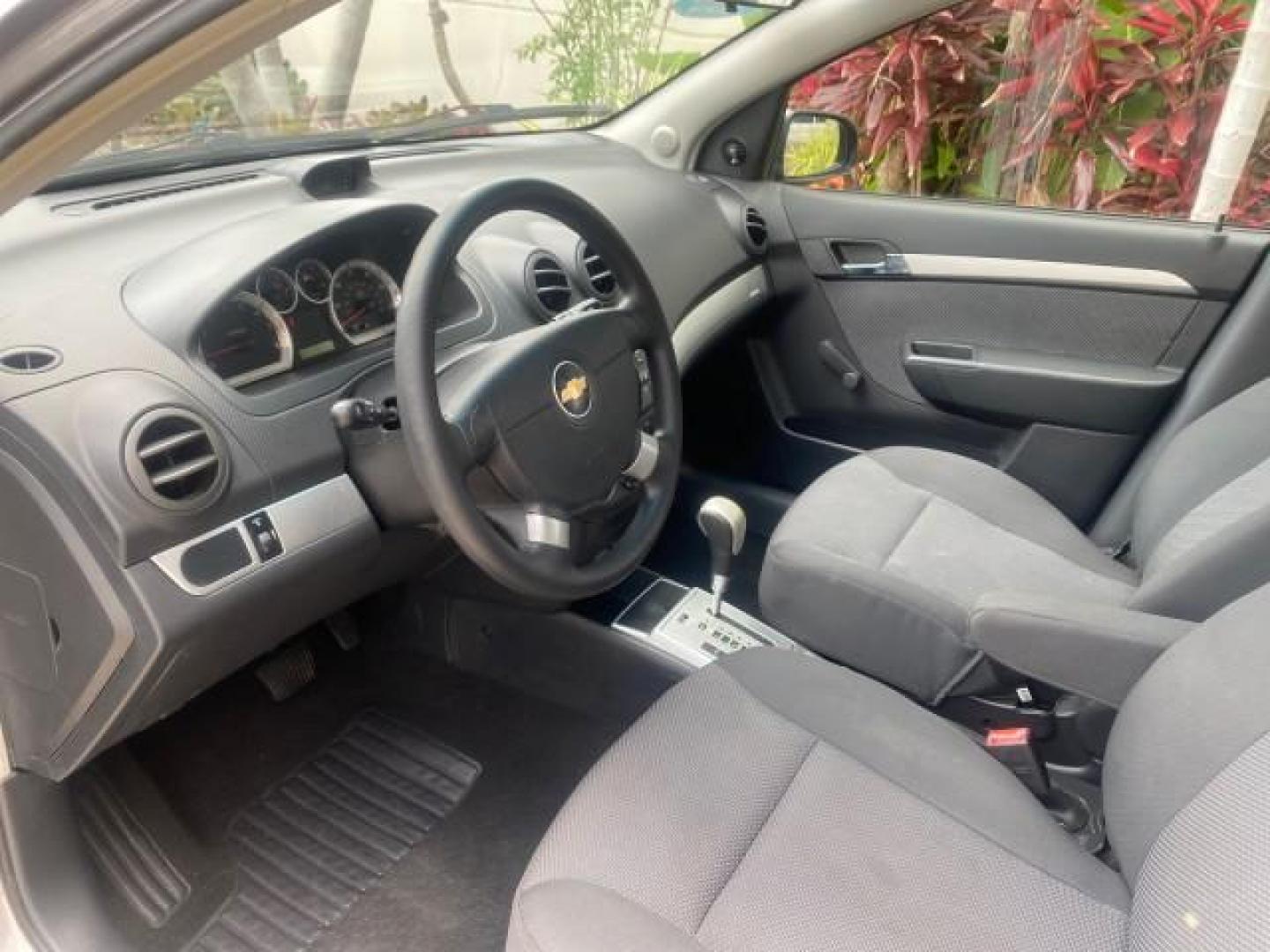 2011 Medium Gray /Charcoal Chevrolet Aveo LS LOW MILES 18,701 (KL1TD5DE5BB) with an Ecotec 1.6L DOHC 16-Valve 4-Cyl MFI Engine engine, Automatic transmission, located at 4701 North Dixie Hwy, Pompano Beach, FL, 33064, (954) 422-2889, 26.240938, -80.123474 - OUR WEBPAGE FLORIDACARS1.COM HAS OVER 100 PHOTOS AND FREE CARFAX LINK 2011 CHEVROLET AVEO LT VIN: KL1TD5DE5BB141987 K L 1 T D 5 D E 5 B B 1 4 1 9 8 7 SEDAN 4 DR 1.6L I4 F DOHC 16V GASOLINE 35 MPG FRONT WHEEL DRIVE Top Features Cloth Seats Basic Features AM/FM Stereo Automatic Transmission Cruise Con - Photo#33