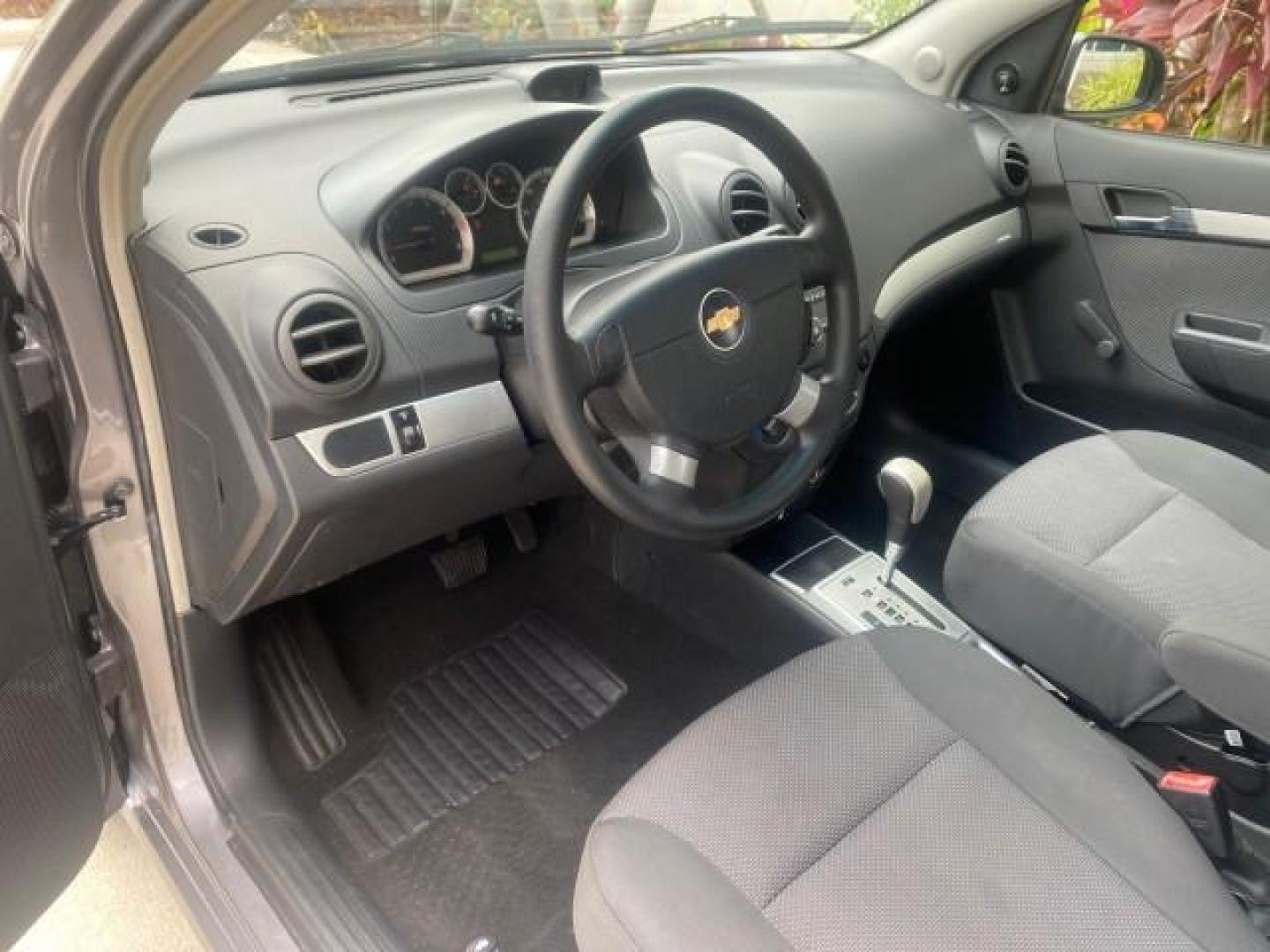 2011 Medium Gray /Charcoal Chevrolet Aveo LS LOW MILES 18,701 (KL1TD5DE5BB) with an Ecotec 1.6L DOHC 16-Valve 4-Cyl MFI Engine engine, Automatic transmission, located at 4701 North Dixie Hwy, Pompano Beach, FL, 33064, (954) 422-2889, 26.240938, -80.123474 - OUR WEBPAGE FLORIDACARS1.COM HAS OVER 100 PHOTOS AND FREE CARFAX LINK 2011 CHEVROLET AVEO LT VIN: KL1TD5DE5BB141987 K L 1 T D 5 D E 5 B B 1 4 1 9 8 7 SEDAN 4 DR 1.6L I4 F DOHC 16V GASOLINE 35 MPG FRONT WHEEL DRIVE Top Features Cloth Seats Basic Features AM/FM Stereo Automatic Transmission Cruise Con - Photo#34