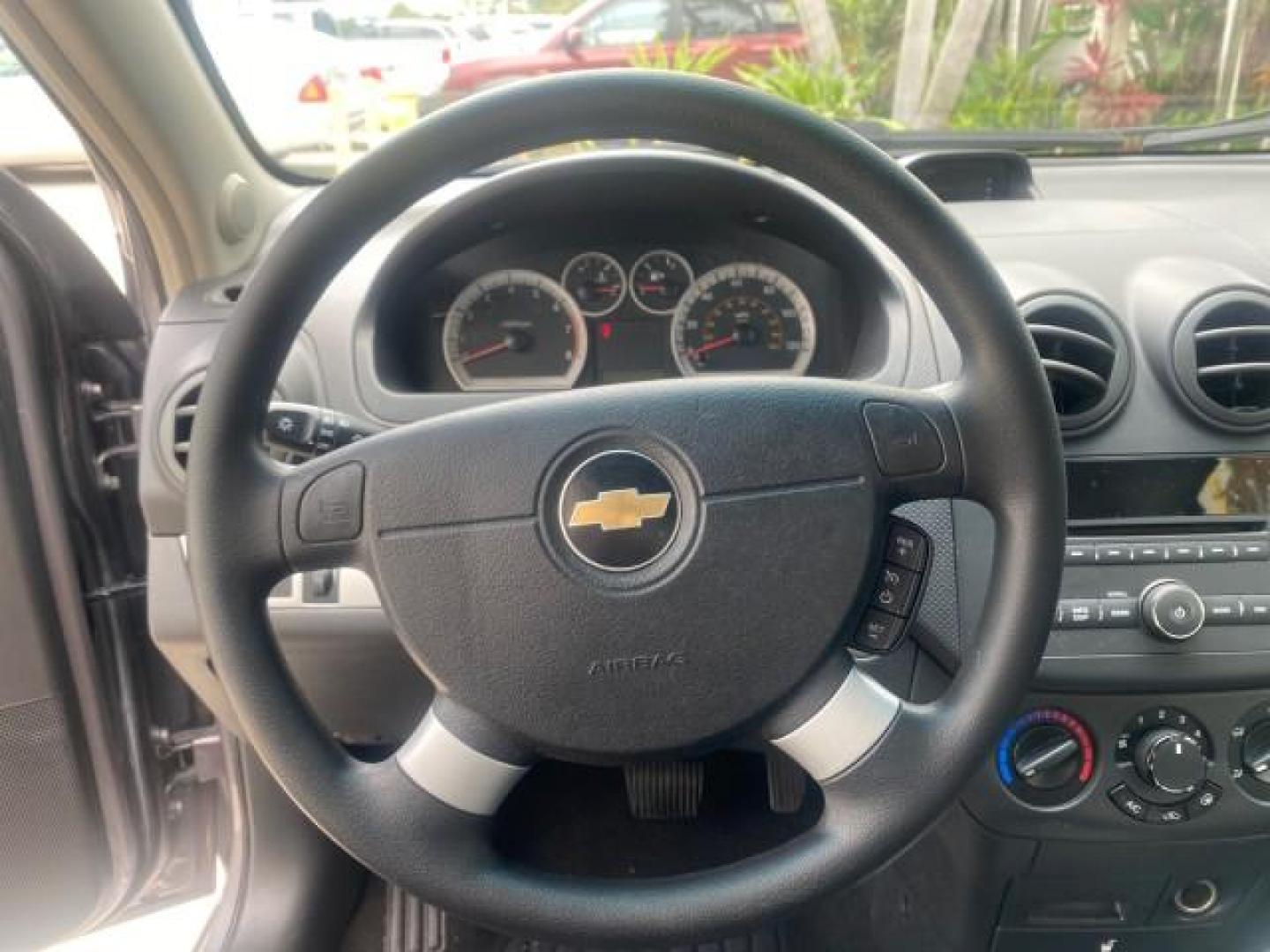 2011 Medium Gray /Charcoal Chevrolet Aveo LS LOW MILES 18,701 (KL1TD5DE5BB) with an Ecotec 1.6L DOHC 16-Valve 4-Cyl MFI Engine engine, Automatic transmission, located at 4701 North Dixie Hwy, Pompano Beach, FL, 33064, (954) 422-2889, 26.240938, -80.123474 - OUR WEBPAGE FLORIDACARS1.COM HAS OVER 100 PHOTOS AND FREE CARFAX LINK 2011 CHEVROLET AVEO LT VIN: KL1TD5DE5BB141987 K L 1 T D 5 D E 5 B B 1 4 1 9 8 7 SEDAN 4 DR 1.6L I4 F DOHC 16V GASOLINE 35 MPG FRONT WHEEL DRIVE Top Features Cloth Seats Basic Features AM/FM Stereo Automatic Transmission Cruise Con - Photo#35