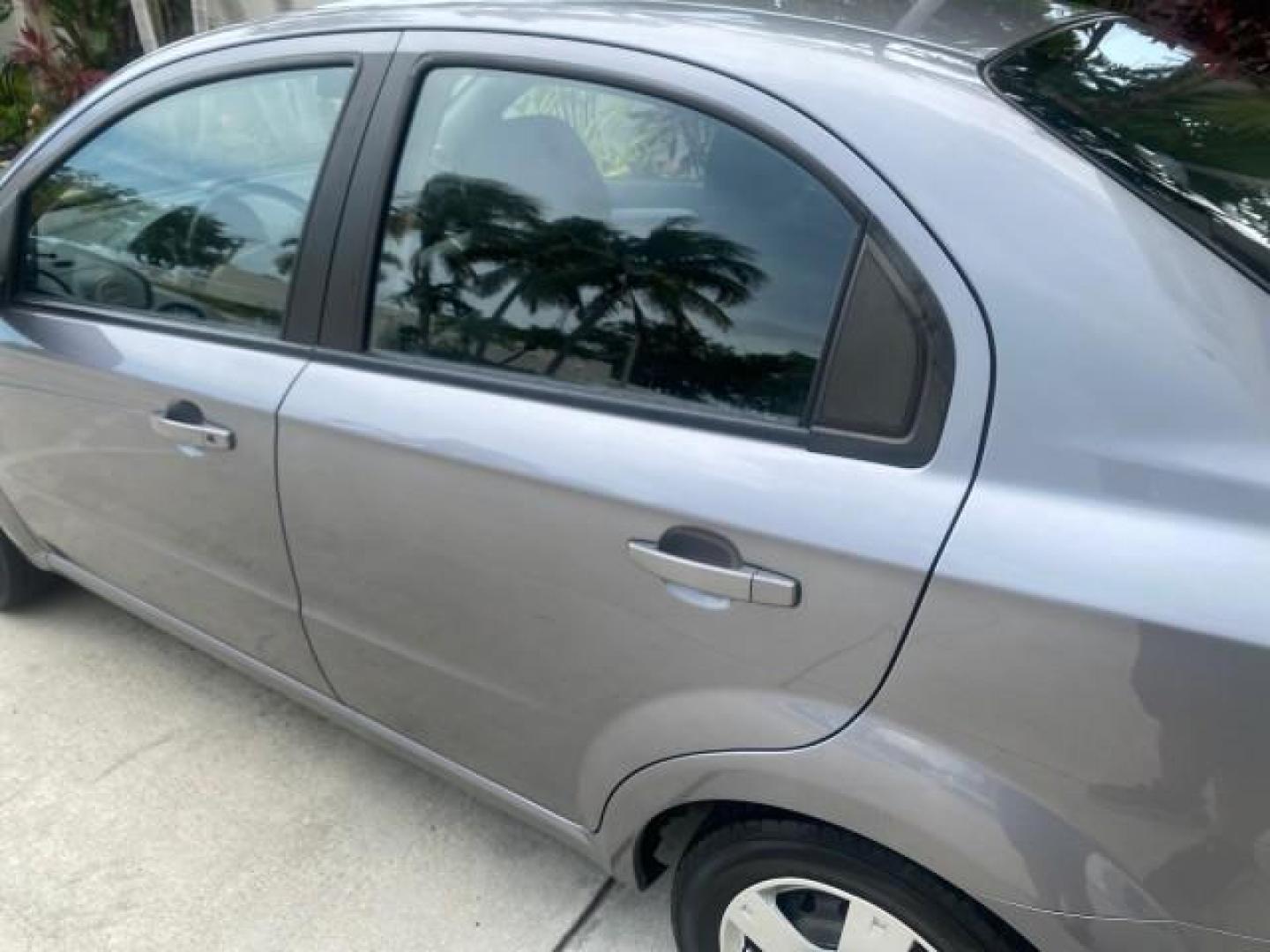 2011 Medium Gray /Charcoal Chevrolet Aveo LS LOW MILES 18,701 (KL1TD5DE5BB) with an Ecotec 1.6L DOHC 16-Valve 4-Cyl MFI Engine engine, Automatic transmission, located at 4701 North Dixie Hwy, Pompano Beach, FL, 33064, (954) 422-2889, 26.240938, -80.123474 - OUR WEBPAGE FLORIDACARS1.COM HAS OVER 100 PHOTOS AND FREE CARFAX LINK 2011 CHEVROLET AVEO LT VIN: KL1TD5DE5BB141987 K L 1 T D 5 D E 5 B B 1 4 1 9 8 7 SEDAN 4 DR 1.6L I4 F DOHC 16V GASOLINE 35 MPG FRONT WHEEL DRIVE Top Features Cloth Seats Basic Features AM/FM Stereo Automatic Transmission Cruise Con - Photo#57