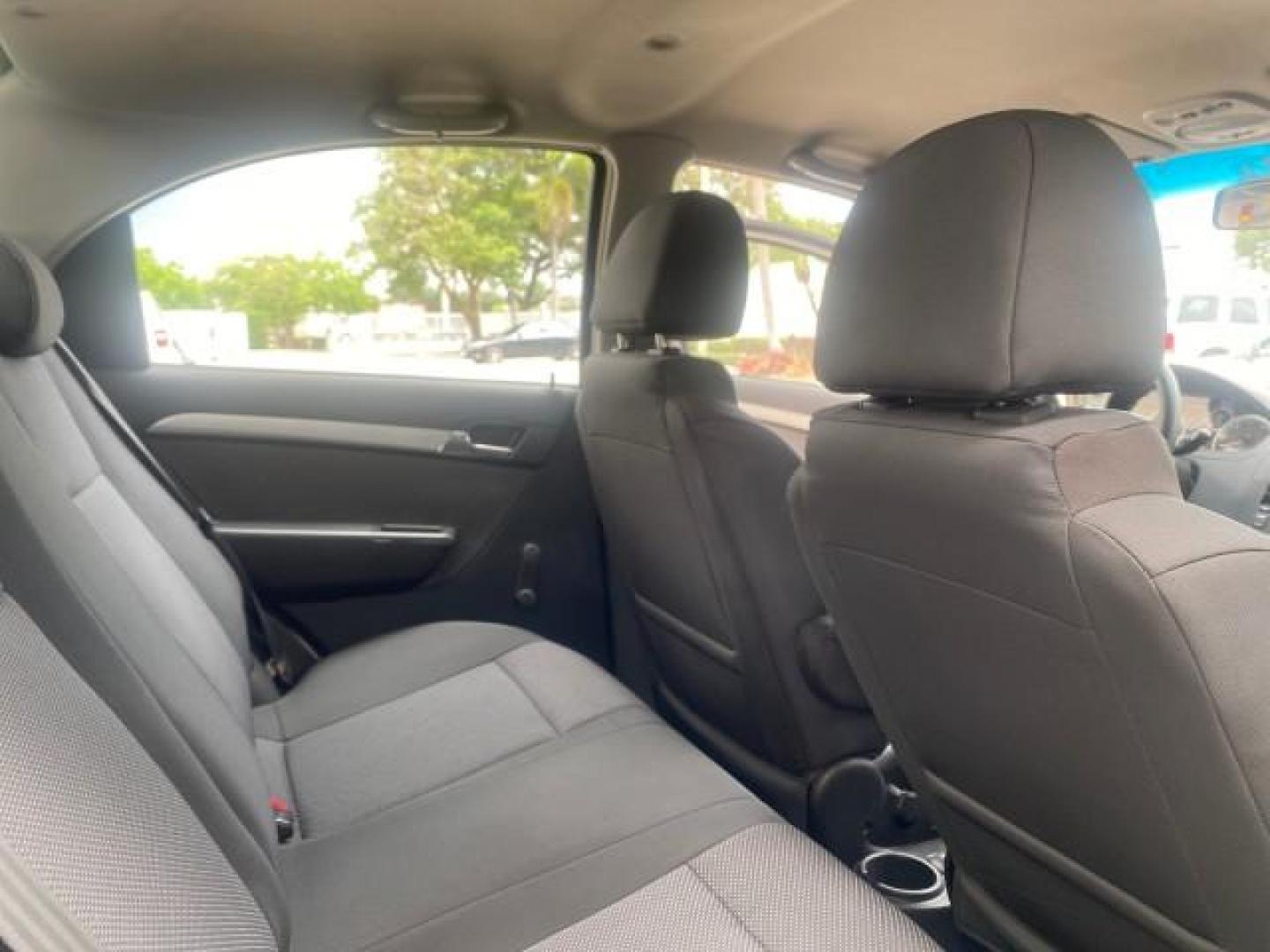 2011 Medium Gray /Charcoal Chevrolet Aveo LS LOW MILES 18,701 (KL1TD5DE5BB) with an Ecotec 1.6L DOHC 16-Valve 4-Cyl MFI Engine engine, Automatic transmission, located at 4701 North Dixie Hwy, Pompano Beach, FL, 33064, (954) 422-2889, 26.240938, -80.123474 - OUR WEBPAGE FLORIDACARS1.COM HAS OVER 100 PHOTOS AND FREE CARFAX LINK 2011 CHEVROLET AVEO LT VIN: KL1TD5DE5BB141987 K L 1 T D 5 D E 5 B B 1 4 1 9 8 7 SEDAN 4 DR 1.6L I4 F DOHC 16V GASOLINE 35 MPG FRONT WHEEL DRIVE Top Features Cloth Seats Basic Features AM/FM Stereo Automatic Transmission Cruise Con - Photo#82