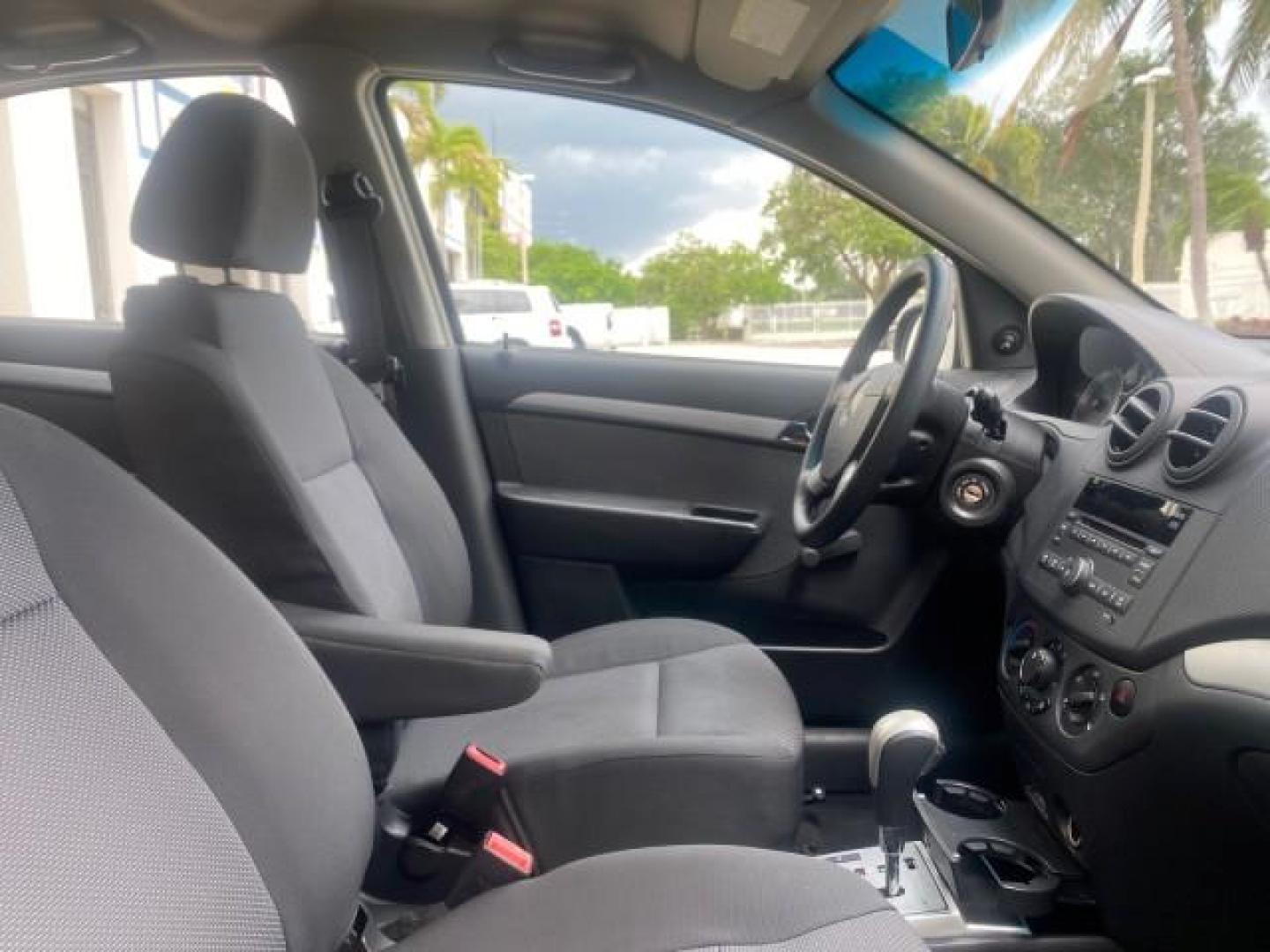 2011 Medium Gray /Charcoal Chevrolet Aveo LS LOW MILES 18,701 (KL1TD5DE5BB) with an Ecotec 1.6L DOHC 16-Valve 4-Cyl MFI Engine engine, Automatic transmission, located at 4701 North Dixie Hwy, Pompano Beach, FL, 33064, (954) 422-2889, 26.240938, -80.123474 - OUR WEBPAGE FLORIDACARS1.COM HAS OVER 100 PHOTOS AND FREE CARFAX LINK 2011 CHEVROLET AVEO LT VIN: KL1TD5DE5BB141987 K L 1 T D 5 D E 5 B B 1 4 1 9 8 7 SEDAN 4 DR 1.6L I4 F DOHC 16V GASOLINE 35 MPG FRONT WHEEL DRIVE Top Features Cloth Seats Basic Features AM/FM Stereo Automatic Transmission Cruise Con - Photo#89