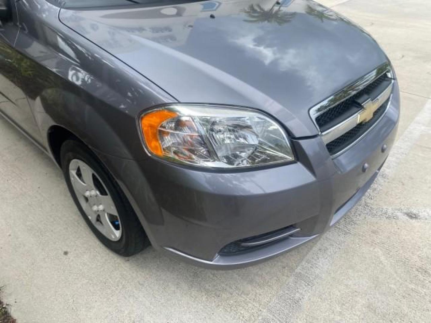 2011 Medium Gray /Charcoal Chevrolet Aveo LS LOW MILES 18,701 (KL1TD5DE5BB) with an Ecotec 1.6L DOHC 16-Valve 4-Cyl MFI Engine engine, Automatic transmission, located at 4701 North Dixie Hwy, Pompano Beach, FL, 33064, (954) 422-2889, 26.240938, -80.123474 - OUR WEBPAGE FLORIDACARS1.COM HAS OVER 100 PHOTOS AND FREE CARFAX LINK 2011 CHEVROLET AVEO LT VIN: KL1TD5DE5BB141987 K L 1 T D 5 D E 5 B B 1 4 1 9 8 7 SEDAN 4 DR 1.6L I4 F DOHC 16V GASOLINE 35 MPG FRONT WHEEL DRIVE Top Features Cloth Seats Basic Features AM/FM Stereo Automatic Transmission Cruise Con - Photo#97