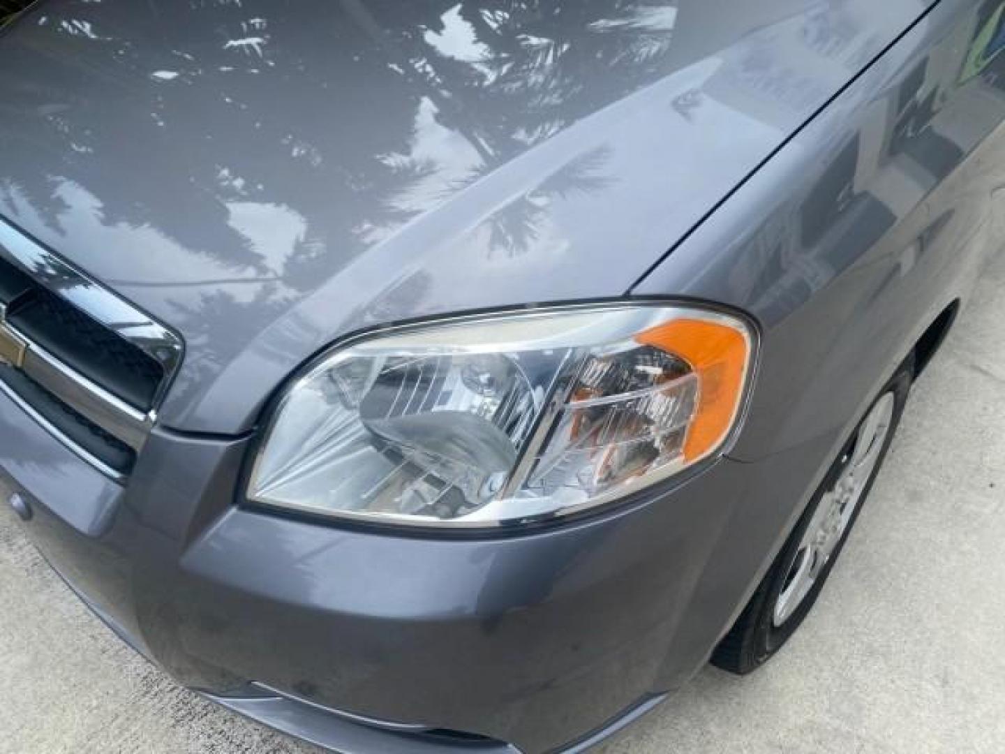 2011 Medium Gray /Charcoal Chevrolet Aveo LS LOW MILES 18,701 (KL1TD5DE5BB) with an Ecotec 1.6L DOHC 16-Valve 4-Cyl MFI Engine engine, Automatic transmission, located at 4701 North Dixie Hwy, Pompano Beach, FL, 33064, (954) 422-2889, 26.240938, -80.123474 - OUR WEBPAGE FLORIDACARS1.COM HAS OVER 100 PHOTOS AND FREE CARFAX LINK 2011 CHEVROLET AVEO LT VIN: KL1TD5DE5BB141987 K L 1 T D 5 D E 5 B B 1 4 1 9 8 7 SEDAN 4 DR 1.6L I4 F DOHC 16V GASOLINE 35 MPG FRONT WHEEL DRIVE Top Features Cloth Seats Basic Features AM/FM Stereo Automatic Transmission Cruise Con - Photo#99