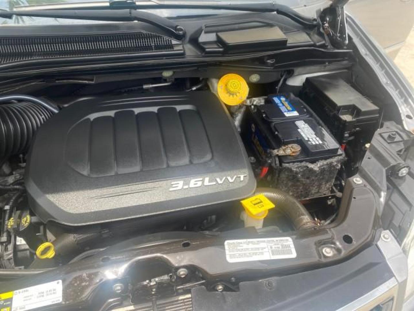 2014 Billet Silver Metallic Clearcoat /Black/Light Graystone Chrysler Town and Country Touring LOW MILES ONLY 46.298 (2C4RC1BG3ER) with an 3.6L V6 Cylinder Engine engine, Automatic transmission, located at 4701 North Dixie Hwy, Pompano Beach, FL, 33064, (954) 422-2889, 26.240938, -80.123474 - OUR WEBPAGE FLORIDACARS1.COM HAS OVER 100 PHOTOS AND FREE CARFAX LINK 2014 CHRYSLER TOWN AND COUNTRY TOURING VIN: 2C4RC1BG3ER206943 2 C 4 R C 1 B G 3 E R 2 0 6 9 4 3 VAN 3.6L V6 F DOHC 24V GASOLINE FRONT WHEEL DRIVE Top Features Alloy Wheels Rear Air Conditioning Bluetooth Technology Rear Entertainm - Photo#26