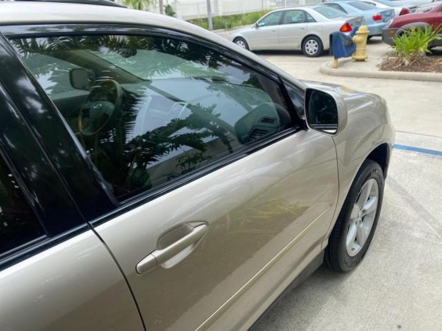 2007 Savannah Metallic /Ivory Lexus RX 350 1 OWNER FLORIDA LOW MILES 83,334 (2T2GK31U47C) with an 3.5L DOHC SMPI 24-Valve V6 Engine engine, Automatic transmission, located at 4701 North Dixie Hwy, Pompano Beach, FL, 33064, (954) 422-2889, 26.240938, -80.123474 - OUR WEBPAGE FLORIDACARS1.COM HAS OVER 100 PHOTOS AND FREE CARFAX LINK 2007 LEXUS RX 350 $ 44,790 NEW VIN: 2T2GK31U47C004222 2 T 2 G K 3 1 U 4 7 C 0 0 4 2 2 2 4 DOOR WAGON/SPORT UTILITY 3.5L V6 F DOHC 24V GASOLINE FRONT WHEEL DRIVE Top Features Alloy Wheels Leather Seats Memory Seat(s) Power Hatch/De - Photo#94