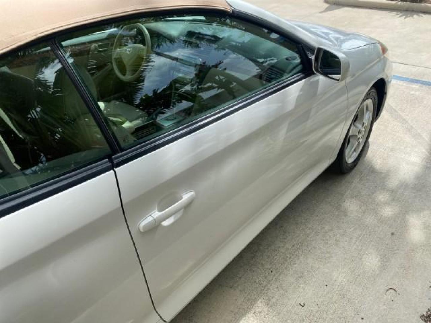 2006 Arctic Frost Pearl /Ivory Toyota Camry Solara SLE V6 1 OWNER LOW MILES 49,530 (4T1FA38P76U) with an 3.3L DOHC SMPI 24-Valve V6 Engine engine, Automatic transmission, located at 4701 North Dixie Hwy, Pompano Beach, FL, 33064, (954) 422-2889, 26.240938, -80.123474 - OUR WEBPAGE FLORIDACARS1.COM HAS OVER 100 PHOTOS AND FREE CARFAX LINK 2006 TOYOTA CAMRY SOLARA SE V6 VIN: 4T1FA38P76U095373 4 T 1 F A 3 8 P 7 6 U 0 9 5 3 7 3 CONVERTIBLE 3.3L V6 F DOHC 24V 29 MPG GASOLINE FRONT WHEEL DRIVE Top Features Alloy Wheels Leather Seats Front Seat Heaters Satellite Radio Re - Photo#78
