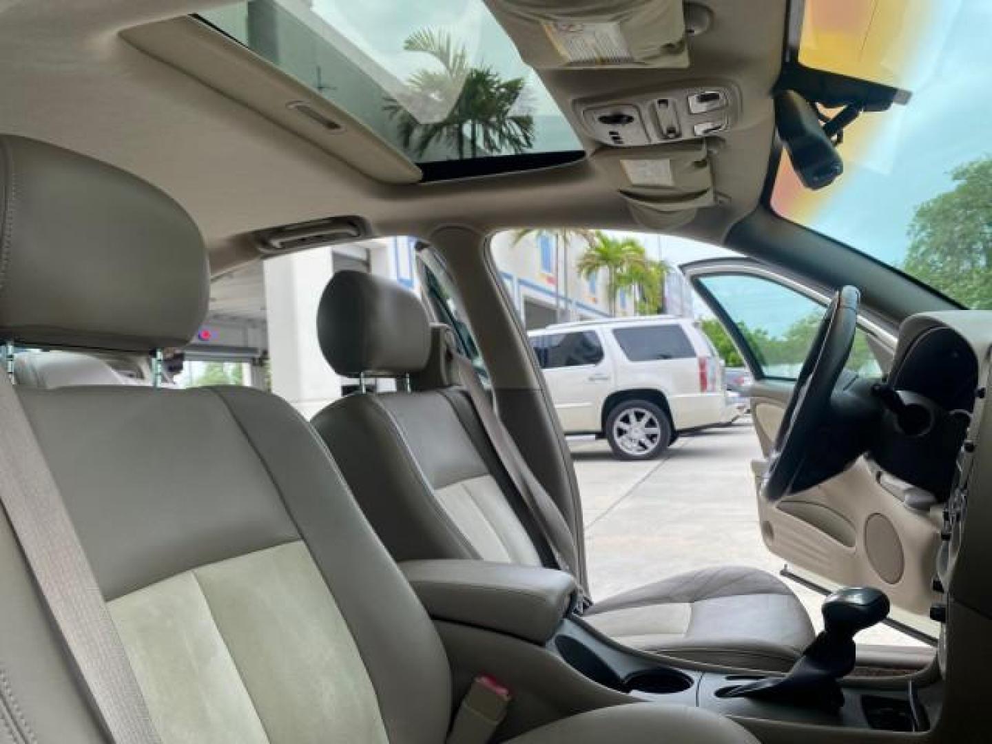 2004 White-Gold Tri Coat /Taupe Pontiac Bonneville GXP LOW MILES 43,734 V8 (1G2HZ54Y34U) with an 4.6L Northstar V8 MFI DOHC Engine engine, Automatic transmission, located at 4701 North Dixie Hwy, Pompano Beach, FL, 33064, (954) 422-2889, 26.240938, -80.123474 - OUR WEBPAGE FLORIDACARS1.COM HAS OVER 100 PHOTOS AND FREE CARFAX LINK 2004 PONTIAC BONNEVILLE GXP $ 38,335 NEW VIN: 1G2HZ54Y34U255377 1 G 2 H Z 5 4 Y 3 4 U 2 5 5 3 7 7 SEDAN 4 DR 4.6L V8 F DOHC GASOLINE FRONT WHEEL DRIVE Top Features Alloy Wheels Front Seat Heaters Head Up Display Leather and Sued - Photo#12