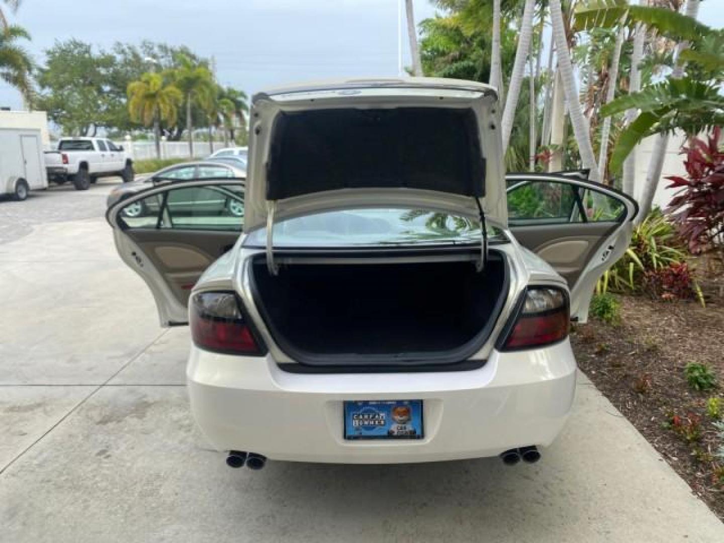 2004 White-Gold Tri Coat /Taupe Pontiac Bonneville GXP LOW MILES 43,734 V8 (1G2HZ54Y34U) with an 4.6L Northstar V8 MFI DOHC Engine engine, Automatic transmission, located at 4701 North Dixie Hwy, Pompano Beach, FL, 33064, (954) 422-2889, 26.240938, -80.123474 - OUR WEBPAGE FLORIDACARS1.COM HAS OVER 100 PHOTOS AND FREE CARFAX LINK 2004 PONTIAC BONNEVILLE GXP $ 38,335 NEW VIN: 1G2HZ54Y34U255377 1 G 2 H Z 5 4 Y 3 4 U 2 5 5 3 7 7 SEDAN 4 DR 4.6L V8 F DOHC GASOLINE FRONT WHEEL DRIVE Top Features Alloy Wheels Front Seat Heaters Head Up Display Leather and Sued - Photo#15
