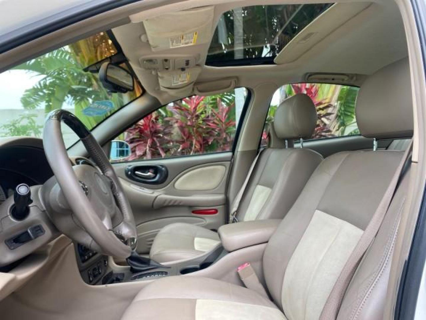 2004 White-Gold Tri Coat /Taupe Pontiac Bonneville GXP LOW MILES 43,734 V8 (1G2HZ54Y34U) with an 4.6L Northstar V8 MFI DOHC Engine engine, Automatic transmission, located at 4701 North Dixie Hwy, Pompano Beach, FL, 33064, (954) 422-2889, 26.240938, -80.123474 - OUR WEBPAGE FLORIDACARS1.COM HAS OVER 100 PHOTOS AND FREE CARFAX LINK 2004 PONTIAC BONNEVILLE GXP $ 38,335 NEW VIN: 1G2HZ54Y34U255377 1 G 2 H Z 5 4 Y 3 4 U 2 5 5 3 7 7 SEDAN 4 DR 4.6L V8 F DOHC GASOLINE FRONT WHEEL DRIVE Top Features Alloy Wheels Front Seat Heaters Head Up Display Leather and Sued - Photo#33