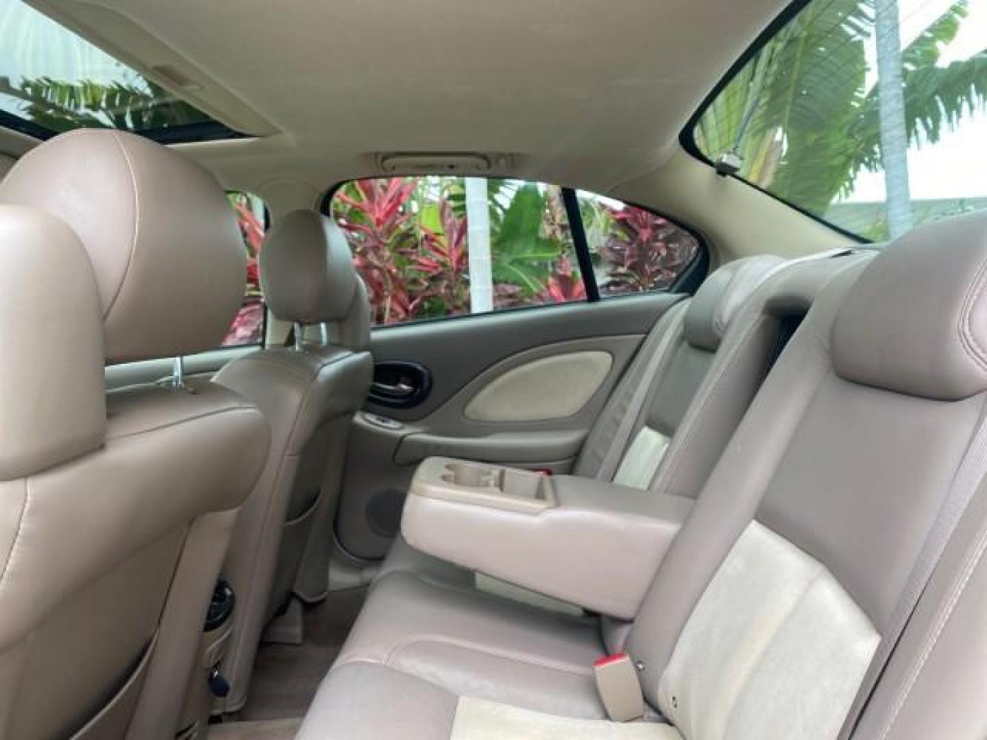 2004 White-Gold Tri Coat /Taupe Pontiac Bonneville GXP LOW MILES 43,734 V8 (1G2HZ54Y34U) with an 4.6L Northstar V8 MFI DOHC Engine engine, Automatic transmission, located at 4701 North Dixie Hwy, Pompano Beach, FL, 33064, (954) 422-2889, 26.240938, -80.123474 - OUR WEBPAGE FLORIDACARS1.COM HAS OVER 100 PHOTOS AND FREE CARFAX LINK 2004 PONTIAC BONNEVILLE GXP $ 38,335 NEW VIN: 1G2HZ54Y34U255377 1 G 2 H Z 5 4 Y 3 4 U 2 5 5 3 7 7 SEDAN 4 DR 4.6L V8 F DOHC GASOLINE FRONT WHEEL DRIVE Top Features Alloy Wheels Front Seat Heaters Head Up Display Leather and Sued - Photo#68