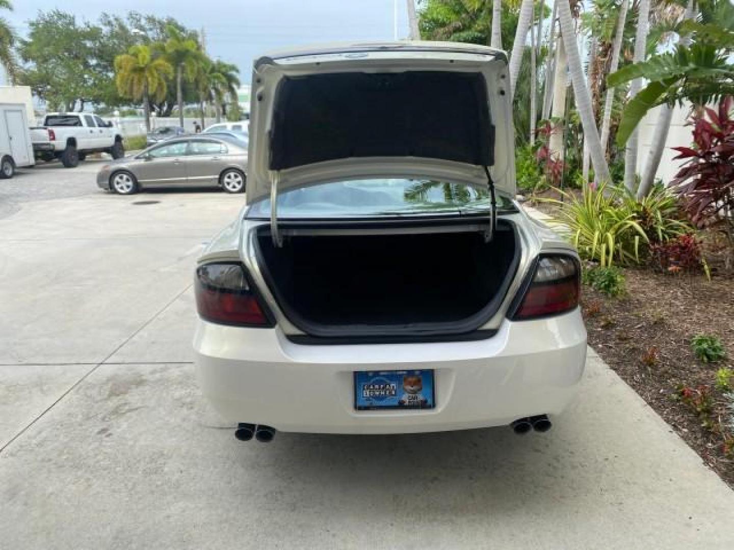 2004 White-Gold Tri Coat /Taupe Pontiac Bonneville GXP LOW MILES 43,734 V8 (1G2HZ54Y34U) with an 4.6L Northstar V8 MFI DOHC Engine engine, Automatic transmission, located at 4701 North Dixie Hwy, Pompano Beach, FL, 33064, (954) 422-2889, 26.240938, -80.123474 - OUR WEBPAGE FLORIDACARS1.COM HAS OVER 100 PHOTOS AND FREE CARFAX LINK 2004 PONTIAC BONNEVILLE GXP $ 38,335 NEW VIN: 1G2HZ54Y34U255377 1 G 2 H Z 5 4 Y 3 4 U 2 5 5 3 7 7 SEDAN 4 DR 4.6L V8 F DOHC GASOLINE FRONT WHEEL DRIVE Top Features Alloy Wheels Front Seat Heaters Head Up Display Leather and Sued - Photo#86