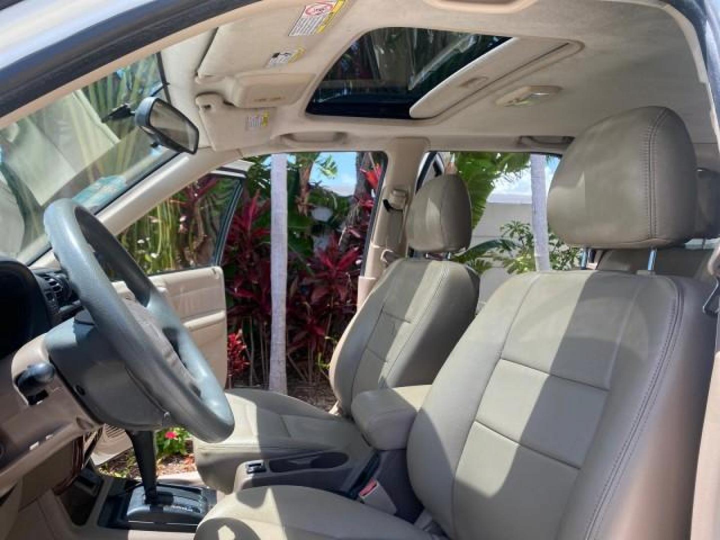 2001 Alpine White /Beige Isuzu Rodeo LSE LOW MILES 78,391 (4S2CK58W814) with an 3.2L DOHC MFI 24-Valve V6 Engine engine, Automatic transmission, located at 4701 North Dixie Hwy, Pompano Beach, FL, 33064, (954) 422-2889, 26.240938, -80.123474 - OUR WEBPAGE FLORIDACARS1.COM HAS OVER 100 PHOTOS AND FREE CARFAX LINK 2001 ISUZU RODEO LSE ROAD READY 3.2L V6 VIN: 4S2CK58W814310263 NO ACCIDENTS 4 DOOR WAGON/SPORT UTILITY NO RECALLS SUNROOF 3.2L DOHC V6 FLORIDA OWNER GASOLINE LOW MILES 78,876 REAR WHEEL DRIVE POWER LEATHER SEATS Approach Lights Cr - Photo#10