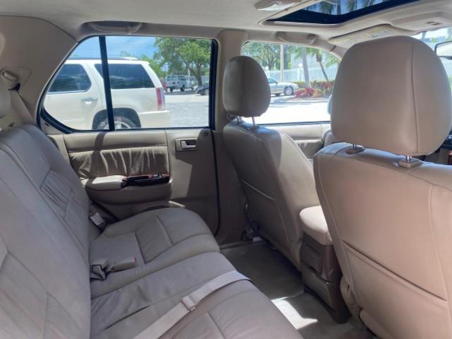 2001 Alpine White /Beige Isuzu Rodeo LSE LOW MILES 78,391 (4S2CK58W814) with an 3.2L DOHC MFI 24-Valve V6 Engine engine, Automatic transmission, located at 4701 North Dixie Hwy, Pompano Beach, FL, 33064, (954) 422-2889, 26.240938, -80.123474 - OUR WEBPAGE FLORIDACARS1.COM HAS OVER 100 PHOTOS AND FREE CARFAX LINK 2001 ISUZU RODEO LSE ROAD READY 3.2L V6 VIN: 4S2CK58W814310263 NO ACCIDENTS 4 DOOR WAGON/SPORT UTILITY NO RECALLS SUNROOF 3.2L DOHC V6 FLORIDA OWNER GASOLINE LOW MILES 78,876 REAR WHEEL DRIVE POWER LEATHER SEATS Approach Lights Cr - Photo#95