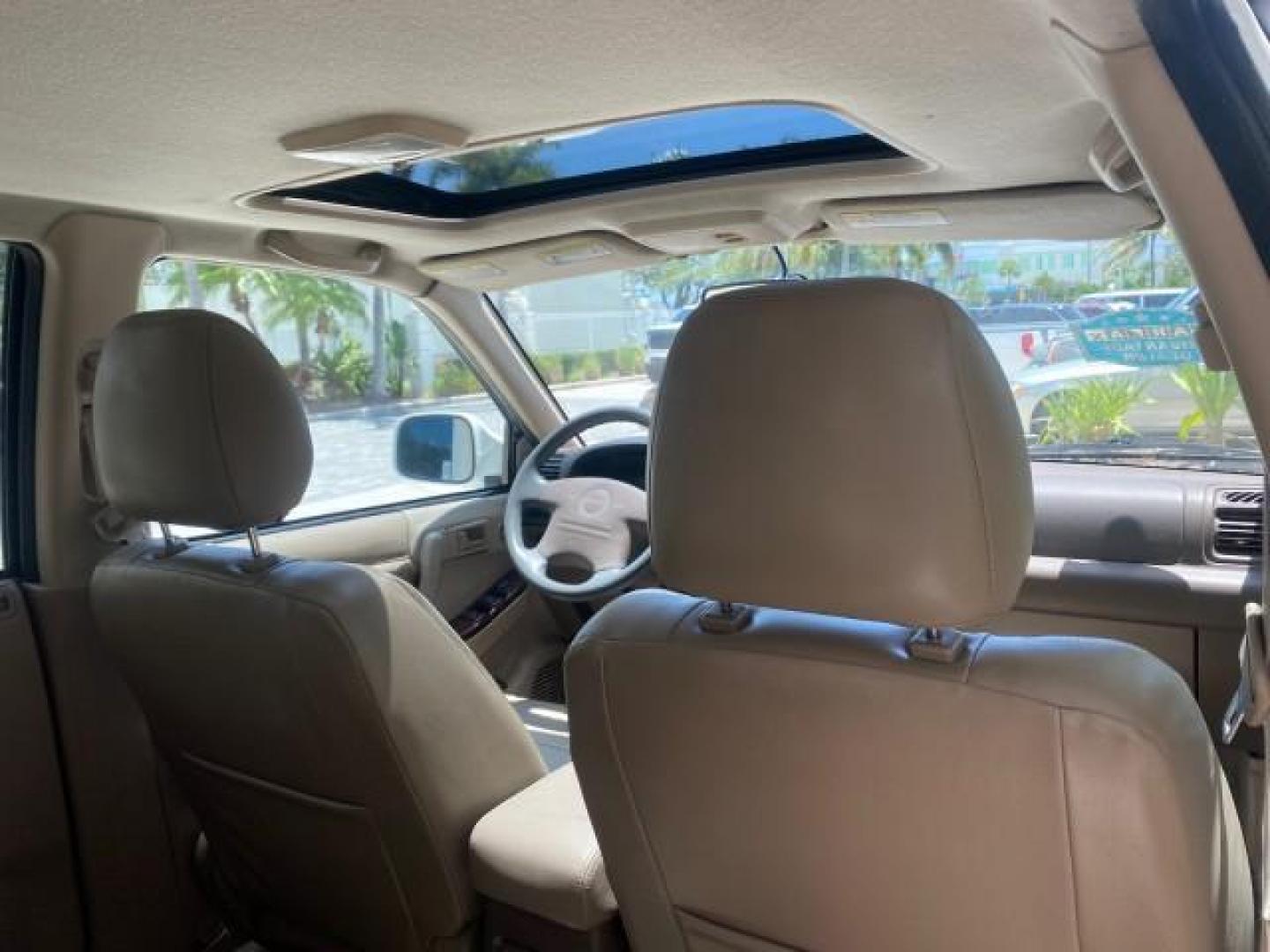 2001 Alpine White /Beige Isuzu Rodeo LSE LOW MILES 78,391 (4S2CK58W814) with an 3.2L DOHC MFI 24-Valve V6 Engine engine, Automatic transmission, located at 4701 North Dixie Hwy, Pompano Beach, FL, 33064, (954) 422-2889, 26.240938, -80.123474 - OUR WEBPAGE FLORIDACARS1.COM HAS OVER 100 PHOTOS AND FREE CARFAX LINK 2001 ISUZU RODEO LSE ROAD READY 3.2L V6 VIN: 4S2CK58W814310263 NO ACCIDENTS 4 DOOR WAGON/SPORT UTILITY NO RECALLS SUNROOF 3.2L DOHC V6 FLORIDA OWNER GASOLINE LOW MILES 78,876 REAR WHEEL DRIVE POWER LEATHER SEATS Approach Lights Cr - Photo#97