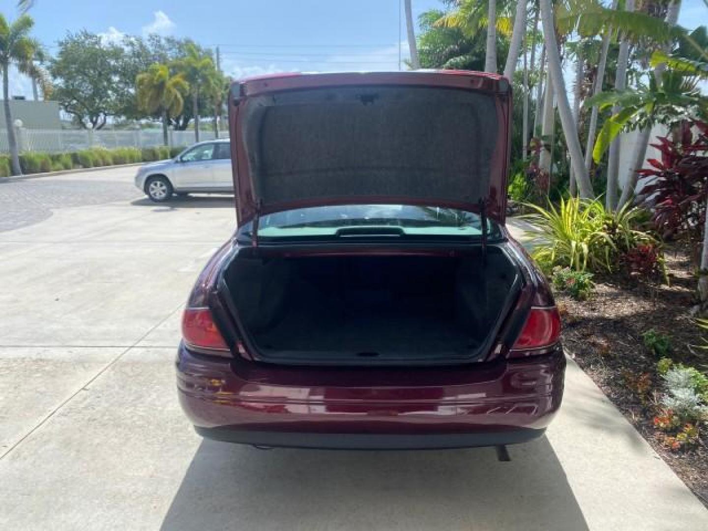 2003 Cabernet Red Metallic /Medium Gray Buick LeSabre Limited 1 OWNER FL LOW MILES 72,247 (1G4HR54KX3U) with an 3.8L 3800 V6 SFI Engine engine, Automatic transmission, located at 4701 North Dixie Hwy, Pompano Beach, FL, 33064, (954) 422-2889, 26.240938, -80.123474 - OUR WEBPAGE FLORIDACARS1.COM HAS OVER 100 PHOTOS AND FREE CARFAX LINK 2003 BUICK LESABRE LIMITED $ 31,795 NEW VIN: 1G4HR54KX3U187919 1 G 4 H R 5 4 K X 3 U 1 8 7 9 1 9 SEDAN 4 DR 3.8L V6 F 12V GASOLINE 29 MPG FRONT WHEEL DRIVE Top Features Alloy Wheels Front Seat Heaters Leather Seats Rear Seat Heate - Photo#80