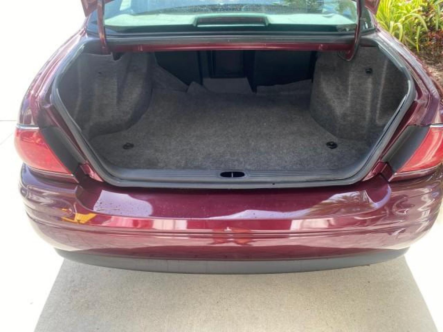 2003 Cabernet Red Metallic /Medium Gray Buick LeSabre Limited 1 OWNER FL LOW MILES 72,247 (1G4HR54KX3U) with an 3.8L 3800 V6 SFI Engine engine, Automatic transmission, located at 4701 North Dixie Hwy, Pompano Beach, FL, 33064, (954) 422-2889, 26.240938, -80.123474 - OUR WEBPAGE FLORIDACARS1.COM HAS OVER 100 PHOTOS AND FREE CARFAX LINK 2003 BUICK LESABRE LIMITED $ 31,795 NEW VIN: 1G4HR54KX3U187919 1 G 4 H R 5 4 K X 3 U 1 8 7 9 1 9 SEDAN 4 DR 3.8L V6 F 12V GASOLINE 29 MPG FRONT WHEEL DRIVE Top Features Alloy Wheels Front Seat Heaters Leather Seats Rear Seat Heate - Photo#81