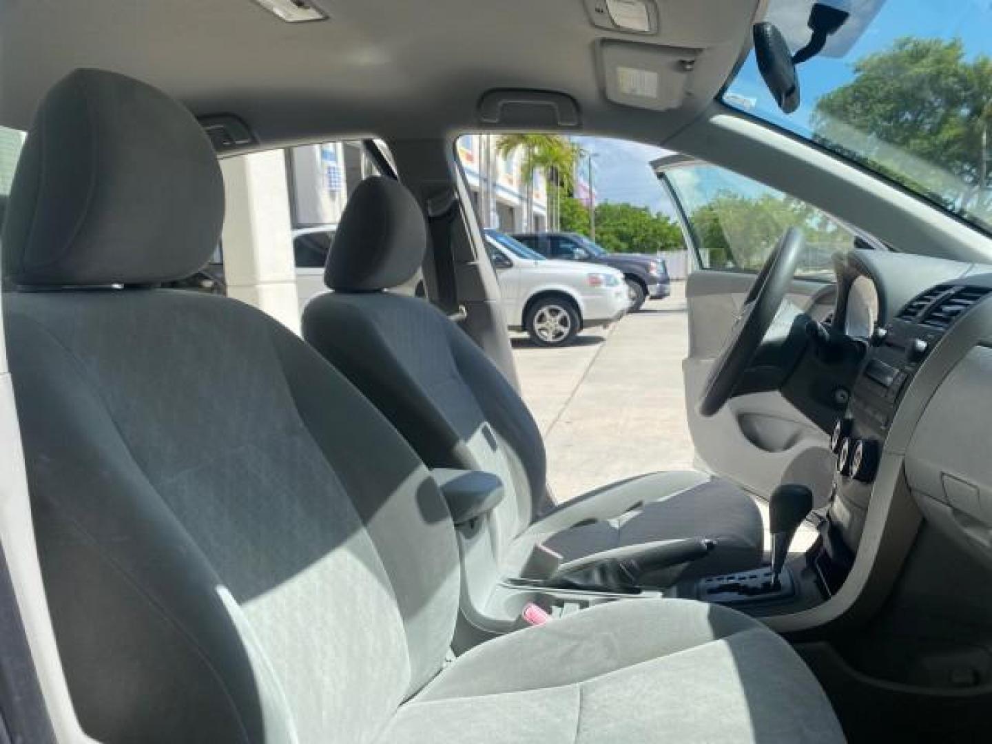 2009 Super White /Ash Toyota Corolla LE 1 OWNER LOW MILES 27,181 (JTDBL40E79J) with an 1.8L DOHC SFI 16-Valve VVT-i 4-Cyl Engine engine, Automatic transmission, located at 4701 North Dixie Hwy, Pompano Beach, FL, 33064, (954) 422-2889, 26.240938, -80.123474 - OUR WEBPAGE FLORIDACARS1.COM HAS OVER 100 PHOTOS AND FREE CARFAX LINK 2009 TOYOTA COROLLA LE VIN: JTDBL40E79J022099 J T D B L 4 0 E 7 9 J 0 2 2 0 9 9 SEDAN 4 DR 1.8L I4 F DOHC 16V 35 MPG GASOLINE FRONT WHEEL DRIVE Top Features Cloth Seats Basic Features ABS Brakes AM/FM Stereo Air Conditioning Autom - Photo#12