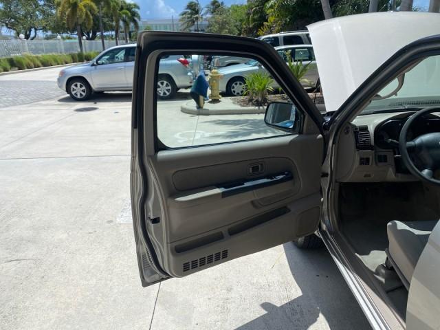 2004 Radiant Silver Metallic /Gray Nissan Frontier 2WD XE LOW MILES 70,694 (1N6DD26T74C) with an 2.4L DOHC SMPI 16-Valve 4-Cyl Engine engine, Manual transmission, located at 4701 North Dixie Hwy, Pompano Beach, FL, 33064, (954) 422-2889, 26.240938, -80.123474 - OUR WEBPAGE FLORIDACARS1.COM HAS OVER 100 PHOTOS AND FREE CARFAX LINK 2004 NISSAN FRONTIER VIN: 1N6DD26T74C451236 CLUB CAB PICKUP 2.4L I4 F DOHC 16V GASOLINE REAR WHEEL DRIVE Top Features Bed Liner Cloth Seats Basic Features ABS Brakes AM/FM Stereo Air Conditioning CD Audio Manual Transmission Power - Photo#9