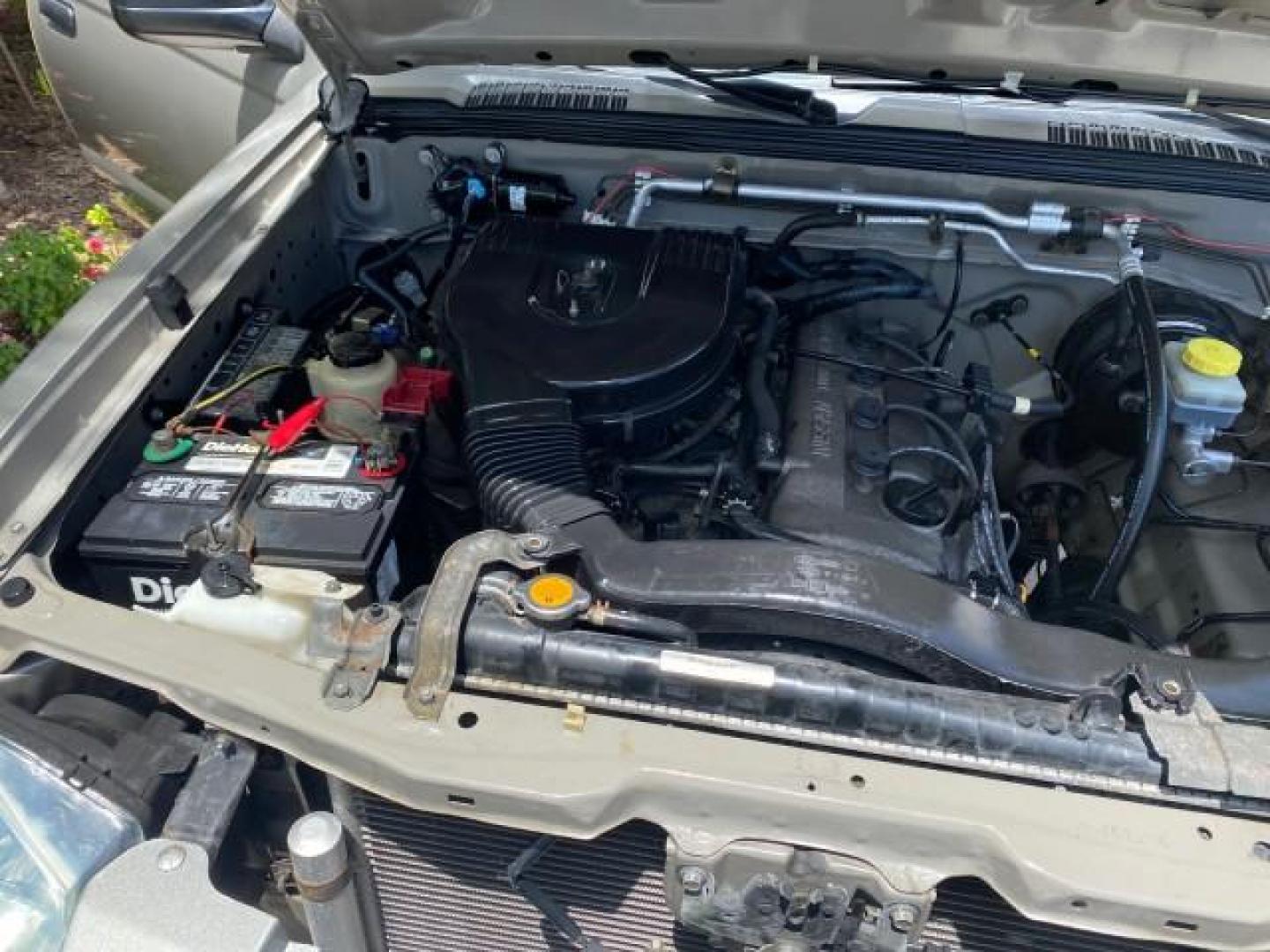 2004 Radiant Silver Metallic /Gray Nissan Frontier 2WD XE LOW MILES 70,508 (1N6DD26T74C) with an 2.4L DOHC SMPI 16-Valve 4-Cyl Engine engine, Manual transmission, located at 4701 North Dixie Hwy, Pompano Beach, FL, 33064, (954) 422-2889, 26.240938, -80.123474 - OUR WEBPAGE FLORIDACARS1.COM HAS OVER 100 PHOTOS AND FREE CARFAX LINK 2004 NISSAN FRONTIER VIN: 1N6DD26T74C451236 CLUB CAB PICKUP 2.4L I4 F DOHC 16V GASOLINE REAR WHEEL DRIVE Top Features Bed Liner Cloth Seats Basic Features ABS Brakes AM/FM Stereo Air Conditioning CD Audio Manual Transmission Power - Photo#25