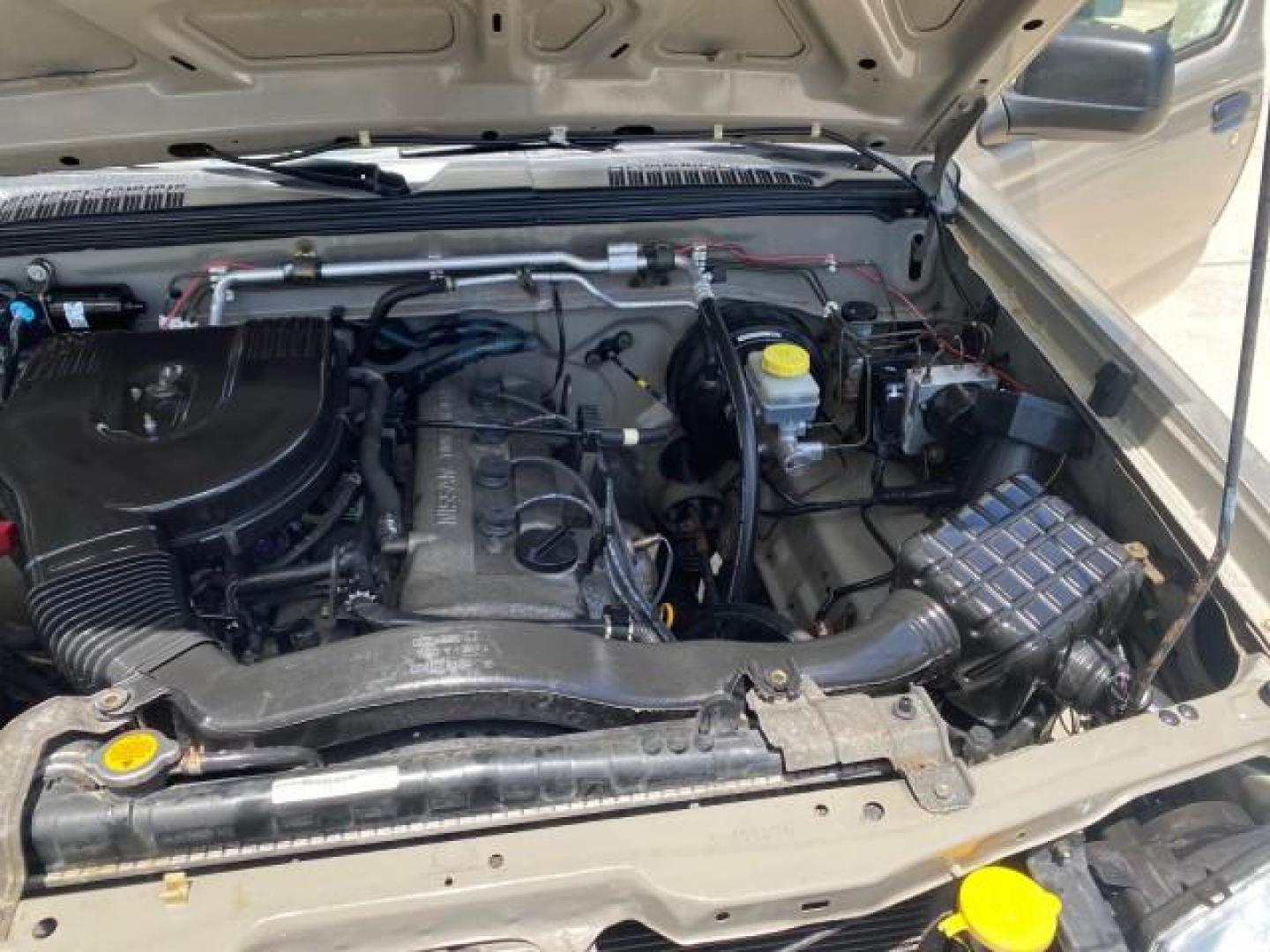 2004 Radiant Silver Metallic /Gray Nissan Frontier 2WD XE LOW MILES 70,508 (1N6DD26T74C) with an 2.4L DOHC SMPI 16-Valve 4-Cyl Engine engine, Manual transmission, located at 4701 North Dixie Hwy, Pompano Beach, FL, 33064, (954) 422-2889, 26.240938, -80.123474 - OUR WEBPAGE FLORIDACARS1.COM HAS OVER 100 PHOTOS AND FREE CARFAX LINK 2004 NISSAN FRONTIER VIN: 1N6DD26T74C451236 CLUB CAB PICKUP 2.4L I4 F DOHC 16V GASOLINE REAR WHEEL DRIVE Top Features Bed Liner Cloth Seats Basic Features ABS Brakes AM/FM Stereo Air Conditioning CD Audio Manual Transmission Power - Photo#26