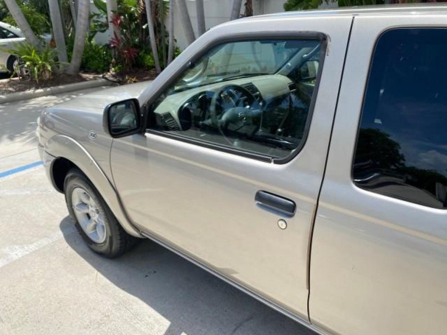2004 Radiant Silver Metallic /Gray Nissan Frontier 2WD XE LOW MILES 70,508 (1N6DD26T74C) with an 2.4L DOHC SMPI 16-Valve 4-Cyl Engine engine, Manual transmission, located at 4701 North Dixie Hwy, Pompano Beach, FL, 33064, (954) 422-2889, 26.240938, -80.123474 - OUR WEBPAGE FLORIDACARS1.COM HAS OVER 100 PHOTOS AND FREE CARFAX LINK 2004 NISSAN FRONTIER VIN: 1N6DD26T74C451236 CLUB CAB PICKUP 2.4L I4 F DOHC 16V GASOLINE REAR WHEEL DRIVE Top Features Bed Liner Cloth Seats Basic Features ABS Brakes AM/FM Stereo Air Conditioning CD Audio Manual Transmission Power - Photo#27