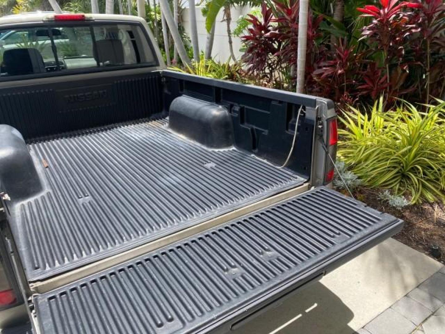 2004 Radiant Silver Metallic /Gray Nissan Frontier 2WD XE LOW MILES 70,508 (1N6DD26T74C) with an 2.4L DOHC SMPI 16-Valve 4-Cyl Engine engine, Manual transmission, located at 4701 North Dixie Hwy, Pompano Beach, FL, 33064, (954) 422-2889, 26.240938, -80.123474 - OUR WEBPAGE FLORIDACARS1.COM HAS OVER 100 PHOTOS AND FREE CARFAX LINK 2004 NISSAN FRONTIER VIN: 1N6DD26T74C451236 CLUB CAB PICKUP 2.4L I4 F DOHC 16V GASOLINE REAR WHEEL DRIVE Top Features Bed Liner Cloth Seats Basic Features ABS Brakes AM/FM Stereo Air Conditioning CD Audio Manual Transmission Power - Photo#73