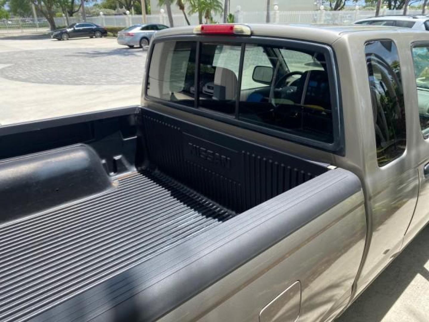 2004 Radiant Silver Metallic /Gray Nissan Frontier 2WD XE LOW MILES 70,508 (1N6DD26T74C) with an 2.4L DOHC SMPI 16-Valve 4-Cyl Engine engine, Manual transmission, located at 4701 North Dixie Hwy, Pompano Beach, FL, 33064, (954) 422-2889, 26.240938, -80.123474 - OUR WEBPAGE FLORIDACARS1.COM HAS OVER 100 PHOTOS AND FREE CARFAX LINK 2004 NISSAN FRONTIER VIN: 1N6DD26T74C451236 CLUB CAB PICKUP 2.4L I4 F DOHC 16V GASOLINE REAR WHEEL DRIVE Top Features Bed Liner Cloth Seats Basic Features ABS Brakes AM/FM Stereo Air Conditioning CD Audio Manual Transmission Power - Photo#79