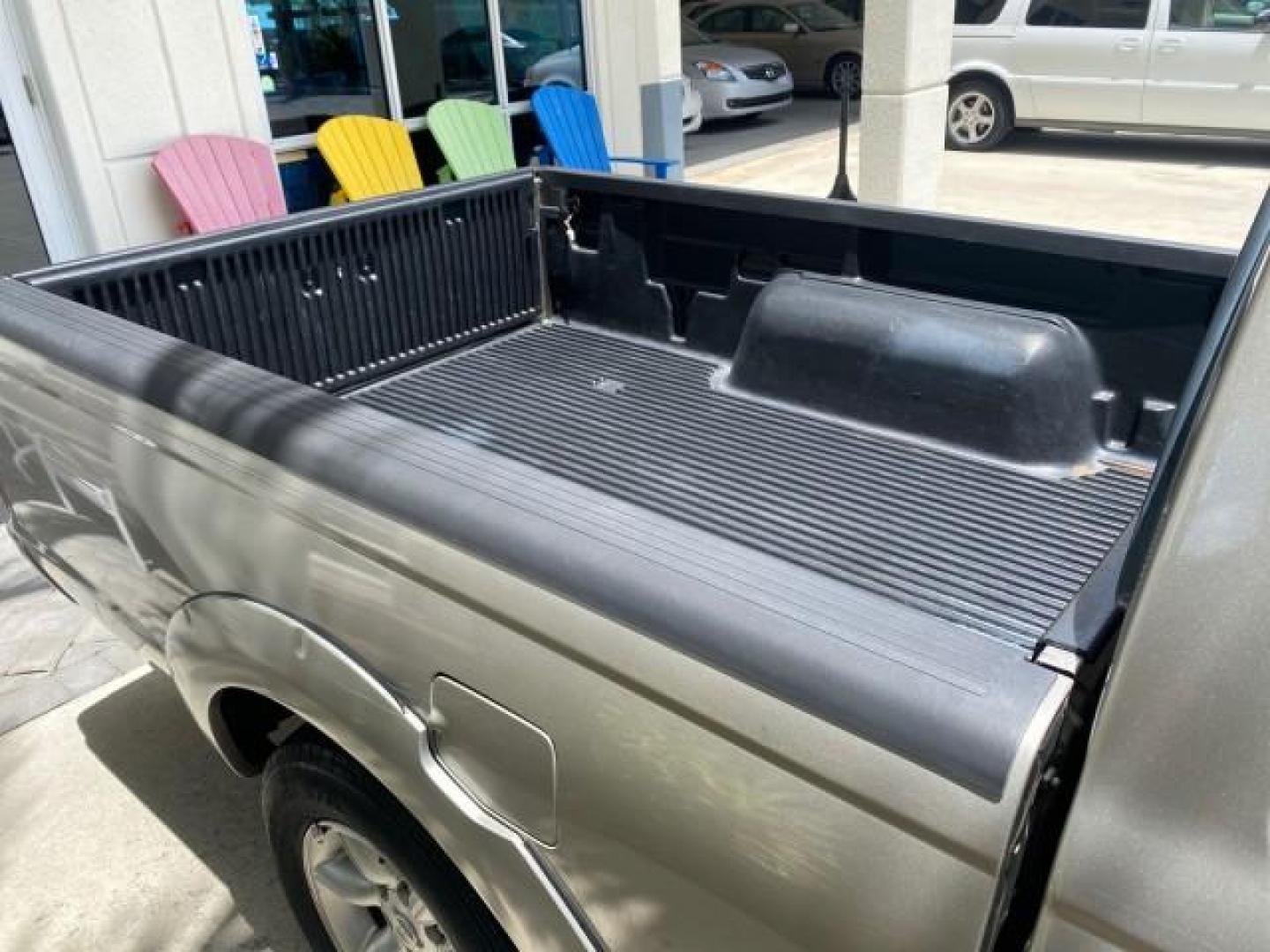 2004 Radiant Silver Metallic /Gray Nissan Frontier 2WD XE LOW MILES 70,508 (1N6DD26T74C) with an 2.4L DOHC SMPI 16-Valve 4-Cyl Engine engine, Manual transmission, located at 4701 North Dixie Hwy, Pompano Beach, FL, 33064, (954) 422-2889, 26.240938, -80.123474 - OUR WEBPAGE FLORIDACARS1.COM HAS OVER 100 PHOTOS AND FREE CARFAX LINK 2004 NISSAN FRONTIER VIN: 1N6DD26T74C451236 CLUB CAB PICKUP 2.4L I4 F DOHC 16V GASOLINE REAR WHEEL DRIVE Top Features Bed Liner Cloth Seats Basic Features ABS Brakes AM/FM Stereo Air Conditioning CD Audio Manual Transmission Power - Photo#80