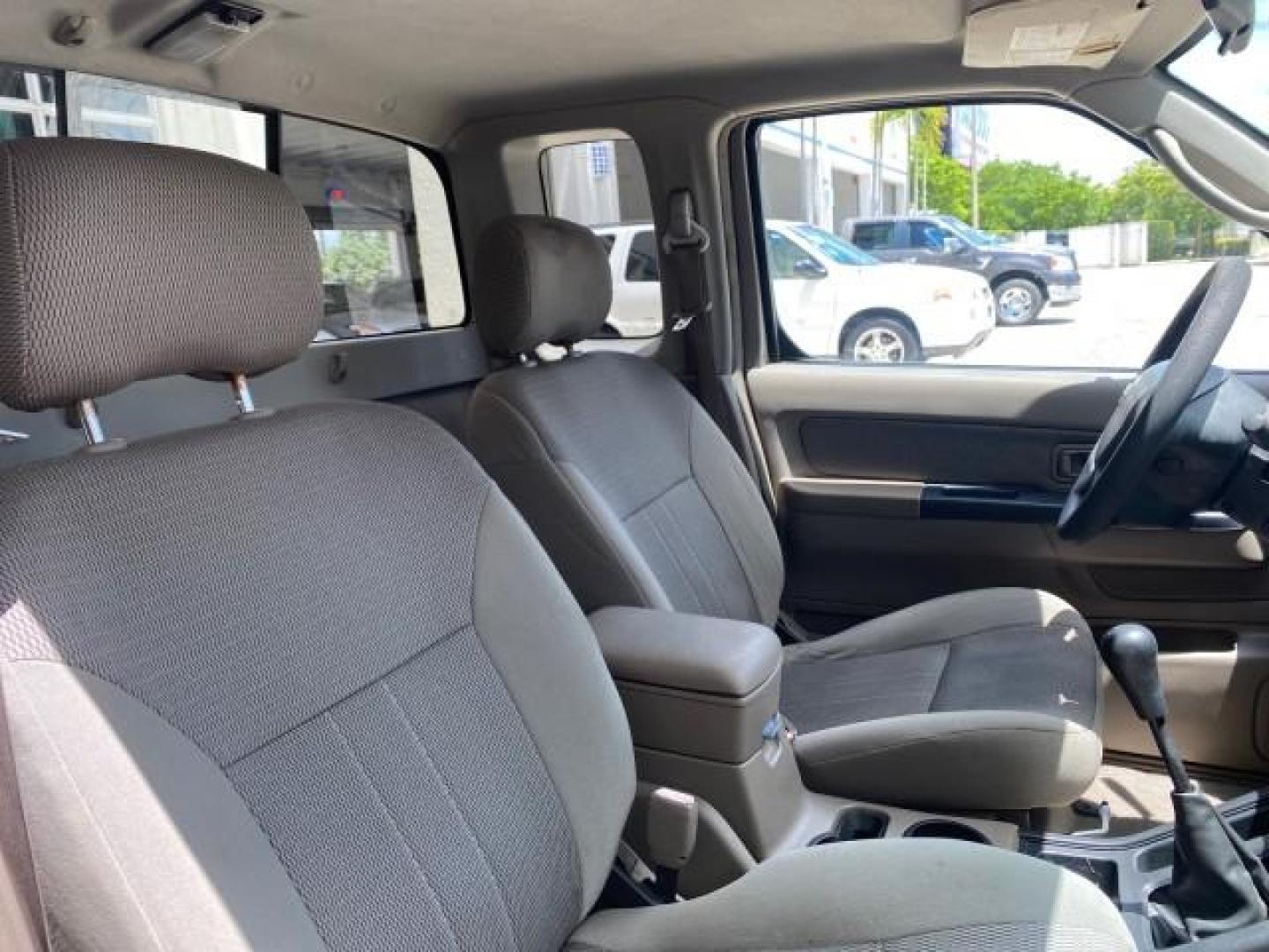 2004 Radiant Silver Metallic /Gray Nissan Frontier 2WD XE LOW MILES 70,508 (1N6DD26T74C) with an 2.4L DOHC SMPI 16-Valve 4-Cyl Engine engine, Manual transmission, located at 4701 North Dixie Hwy, Pompano Beach, FL, 33064, (954) 422-2889, 26.240938, -80.123474 - OUR WEBPAGE FLORIDACARS1.COM HAS OVER 100 PHOTOS AND FREE CARFAX LINK 2004 NISSAN FRONTIER VIN: 1N6DD26T74C451236 CLUB CAB PICKUP 2.4L I4 F DOHC 16V GASOLINE REAR WHEEL DRIVE Top Features Bed Liner Cloth Seats Basic Features ABS Brakes AM/FM Stereo Air Conditioning CD Audio Manual Transmission Power - Photo#86