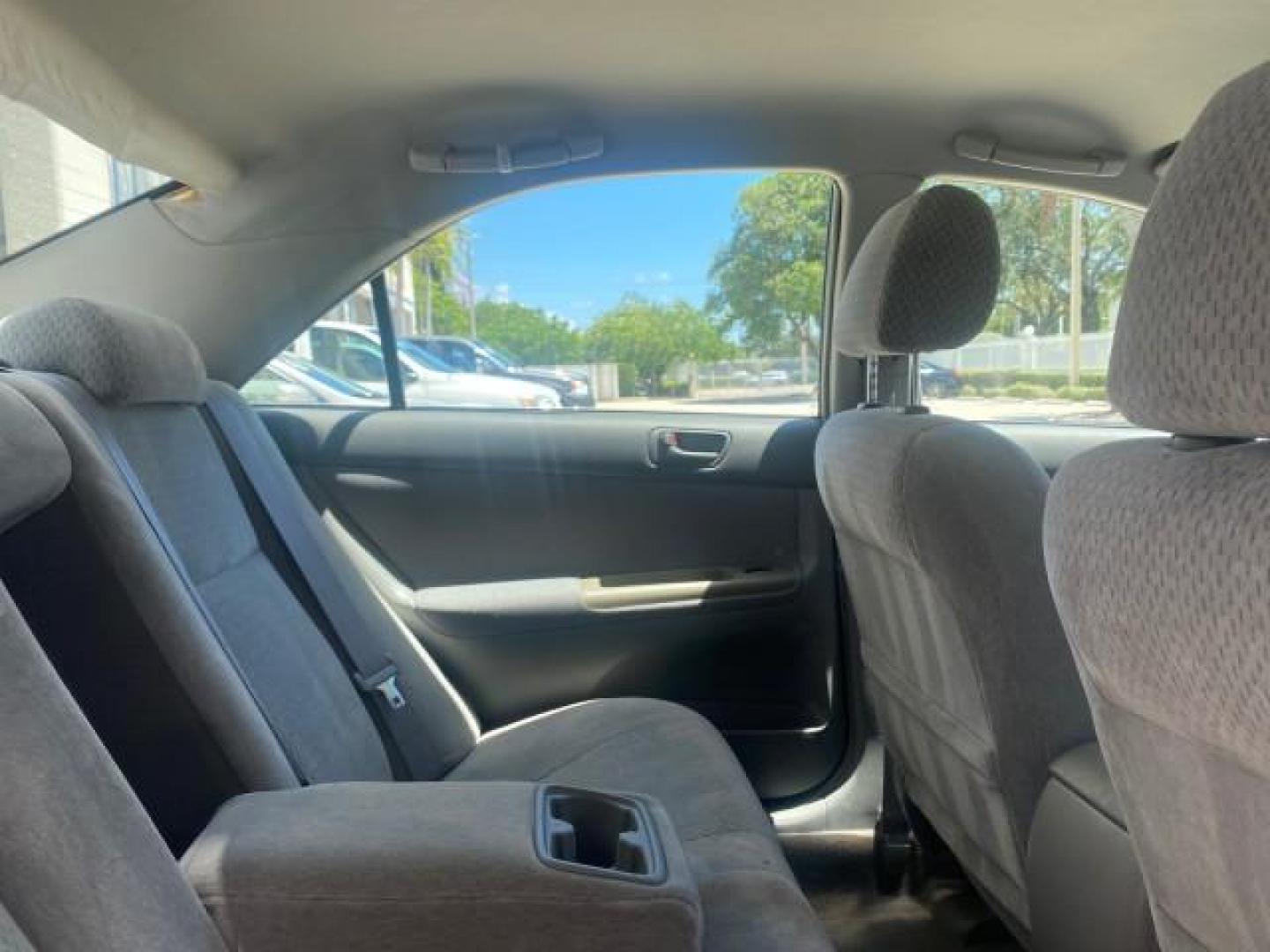 2003 Phantom Gray Pearl /Stone Toyota Camry LE 1 OWNER LOW MILES 68,159 (4T1BE32K23U) with an 2.4L DOHC Vvti 16-Valve 4-Cyl Engine engine, Automatic transmission, located at 4701 North Dixie Hwy, Pompano Beach, FL, 33064, (954) 422-2889, 26.240938, -80.123474 - OUR WEBPAGE FLORIDACARS1.COM HAS OVER 100 PHOTOS AND FREE CARFAX LINK 2003 TOYOTA CAMRY LE VIN: 4T1BE32K23U150498 4 T 1 B E 3 2 K 2 3 U 1 5 0 4 9 8 SEDAN 4 DR 2.4L I4 F DOHC 16V GASOLINE FRONT WHEEL DRIVE Top Features Cloth Seats Basic Features ABS Brakes Automatic Transmission Power Locks Power Win - Photo#91
