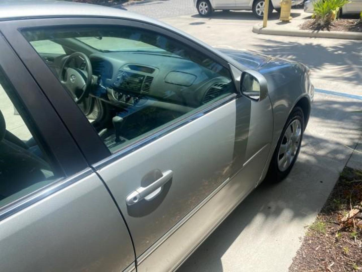 2003 Phantom Gray Pearl /Stone Toyota Camry LE 1 OWNER LOW MILES 68,159 (4T1BE32K23U) with an 2.4L DOHC Vvti 16-Valve 4-Cyl Engine engine, Automatic transmission, located at 4701 North Dixie Hwy, Pompano Beach, FL, 33064, (954) 422-2889, 26.240938, -80.123474 - OUR WEBPAGE FLORIDACARS1.COM HAS OVER 100 PHOTOS AND FREE CARFAX LINK 2003 TOYOTA CAMRY LE VIN: 4T1BE32K23U150498 4 T 1 B E 3 2 K 2 3 U 1 5 0 4 9 8 SEDAN 4 DR 2.4L I4 F DOHC 16V GASOLINE FRONT WHEEL DRIVE Top Features Cloth Seats Basic Features ABS Brakes Automatic Transmission Power Locks Power Win - Photo#95