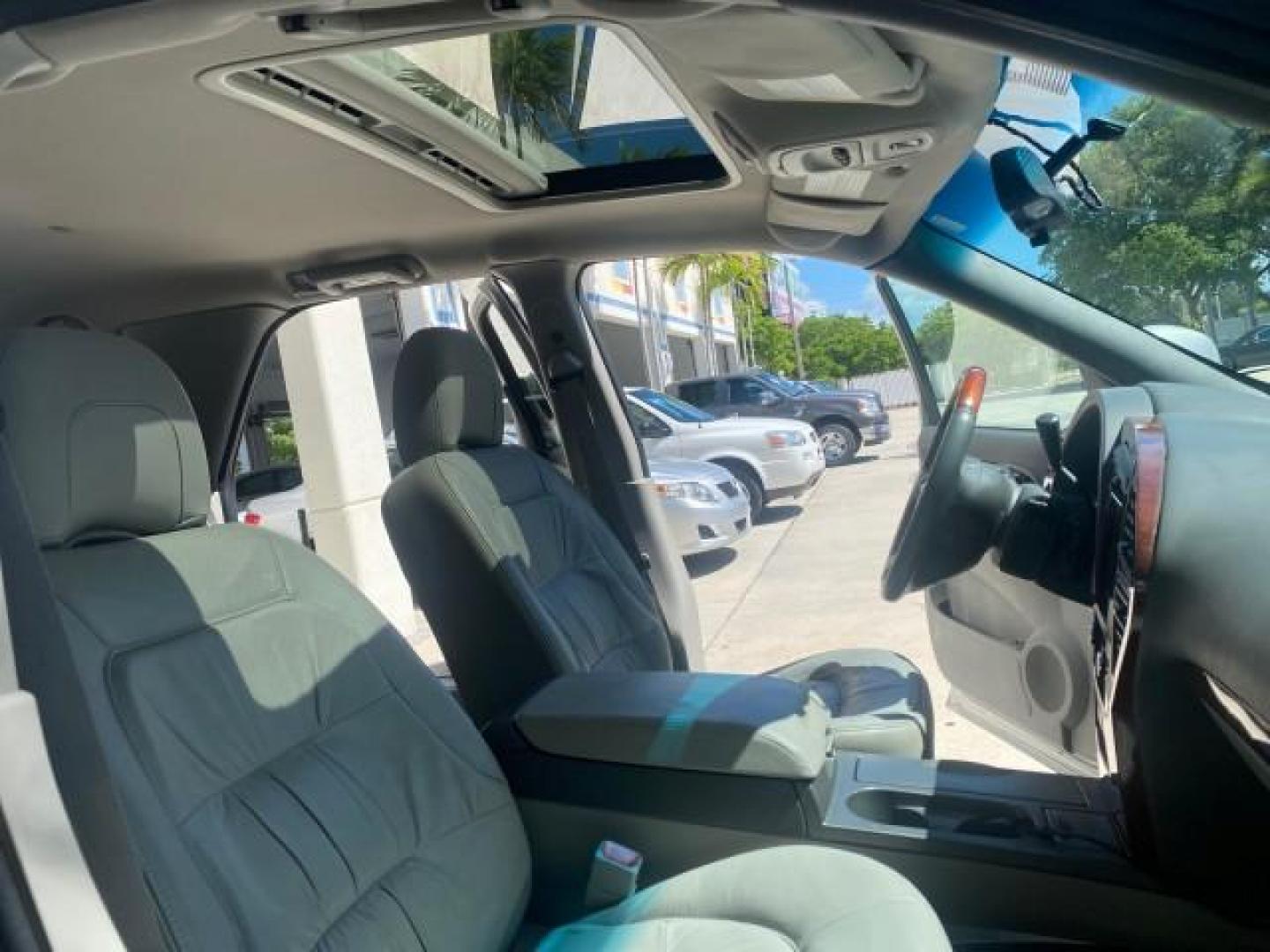 2005 Platinum Metallic /Gray Buick Rendezvous LOW MILES 81,783 3RD ROW (3G5DA03E15S) with an 3.4L 3400 V6 SFI Engine engine, Automatic transmission, located at 4701 North Dixie Hwy, Pompano Beach, FL, 33064, (954) 422-2889, 26.240938, -80.123474 - OUR WEBPAGE FLORIDACARS1.COM HAS OVER 100 PHOTOS AND FREE CARFAX LINK 2005 BUICK RENDEZVOUS CX VIN: 3G5DA03E15S512878 3 G 5 D A 0 3 E 1 5 S 5 1 2 8 7 8 4 DOOR WAGON/SPORT UTILITY 3.4L V6 F GASOLINE FRONT WHEEL DRIVE Top Features Front Seat Heaters Leather Seats Parking Sensors Sunroof(s) Third Row S - Photo#12