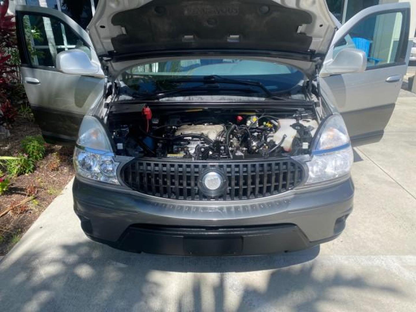 2005 Platinum Metallic /Gray Buick Rendezvous LOW MILES 81,783 3RD ROW (3G5DA03E15S) with an 3.4L 3400 V6 SFI Engine engine, Automatic transmission, located at 4701 North Dixie Hwy, Pompano Beach, FL, 33064, (954) 422-2889, 26.240938, -80.123474 - OUR WEBPAGE FLORIDACARS1.COM HAS OVER 100 PHOTOS AND FREE CARFAX LINK 2005 BUICK RENDEZVOUS CX VIN: 3G5DA03E15S512878 3 G 5 D A 0 3 E 1 5 S 5 1 2 8 7 8 4 DOOR WAGON/SPORT UTILITY 3.4L V6 F GASOLINE FRONT WHEEL DRIVE Top Features Front Seat Heaters Leather Seats Parking Sensors Sunroof(s) Third Row S - Photo#17