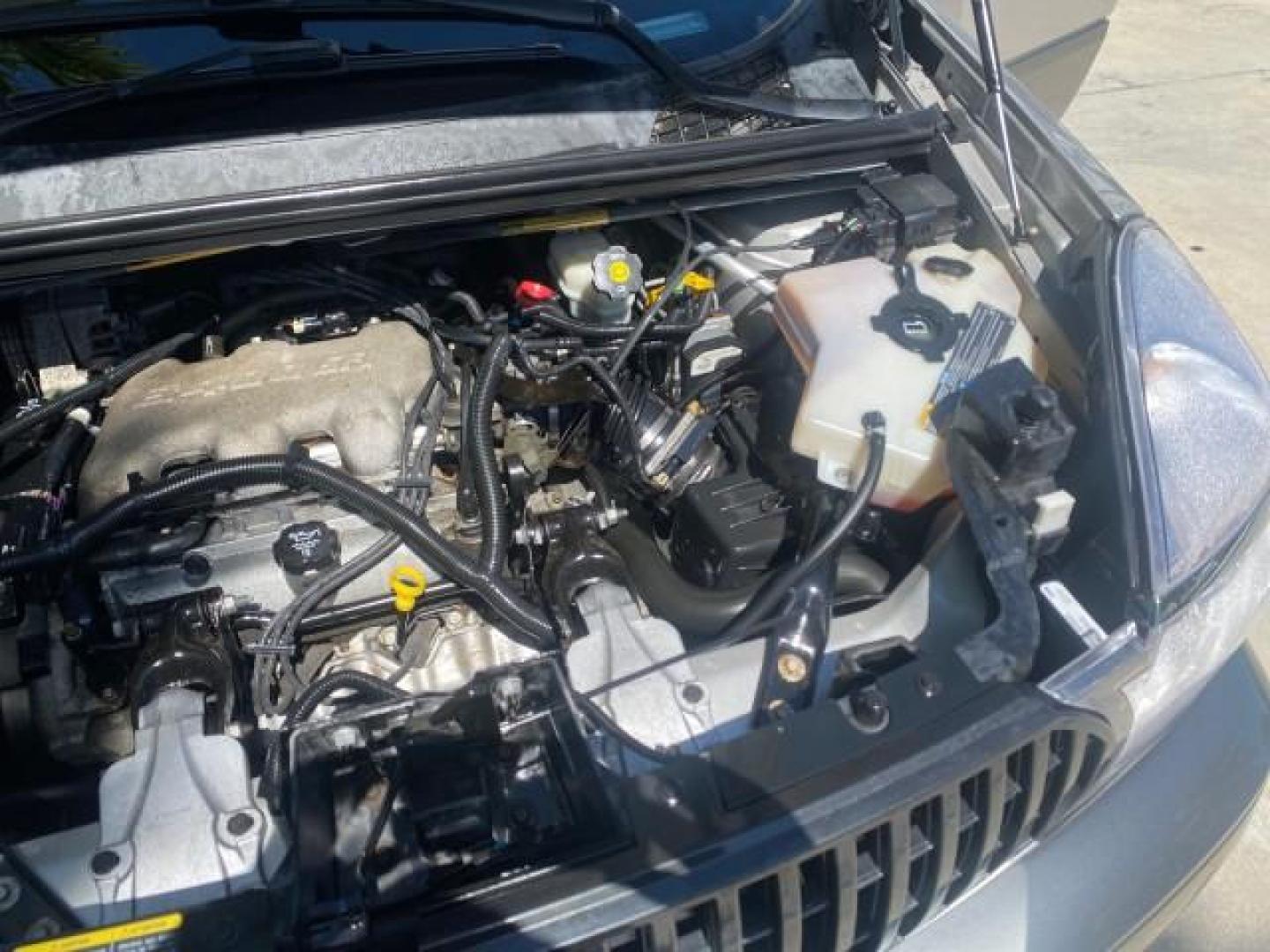 2005 Platinum Metallic /Gray Buick Rendezvous LOW MILES 81,783 3RD ROW (3G5DA03E15S) with an 3.4L 3400 V6 SFI Engine engine, Automatic transmission, located at 4701 North Dixie Hwy, Pompano Beach, FL, 33064, (954) 422-2889, 26.240938, -80.123474 - OUR WEBPAGE FLORIDACARS1.COM HAS OVER 100 PHOTOS AND FREE CARFAX LINK 2005 BUICK RENDEZVOUS CX VIN: 3G5DA03E15S512878 3 G 5 D A 0 3 E 1 5 S 5 1 2 8 7 8 4 DOOR WAGON/SPORT UTILITY 3.4L V6 F GASOLINE FRONT WHEEL DRIVE Top Features Front Seat Heaters Leather Seats Parking Sensors Sunroof(s) Third Row S - Photo#26
