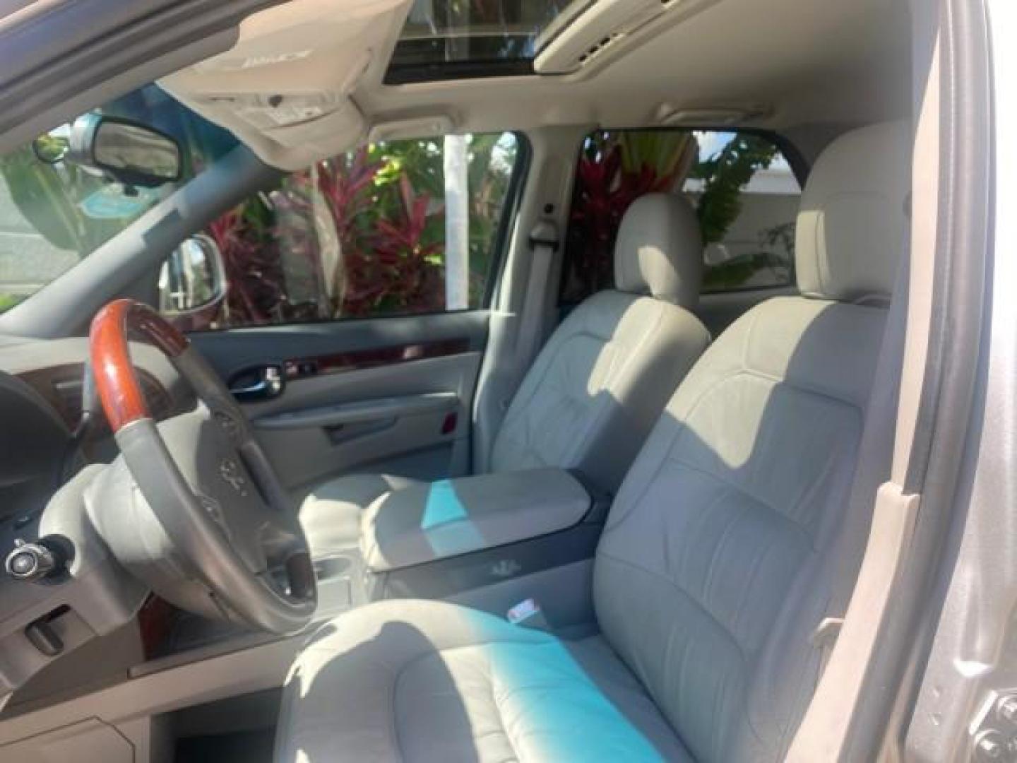 2005 Platinum Metallic /Gray Buick Rendezvous LOW MILES 81,783 3RD ROW (3G5DA03E15S) with an 3.4L 3400 V6 SFI Engine engine, Automatic transmission, located at 4701 North Dixie Hwy, Pompano Beach, FL, 33064, (954) 422-2889, 26.240938, -80.123474 - OUR WEBPAGE FLORIDACARS1.COM HAS OVER 100 PHOTOS AND FREE CARFAX LINK 2005 BUICK RENDEZVOUS CX VIN: 3G5DA03E15S512878 3 G 5 D A 0 3 E 1 5 S 5 1 2 8 7 8 4 DOOR WAGON/SPORT UTILITY 3.4L V6 F GASOLINE FRONT WHEEL DRIVE Top Features Front Seat Heaters Leather Seats Parking Sensors Sunroof(s) Third Row S - Photo#33