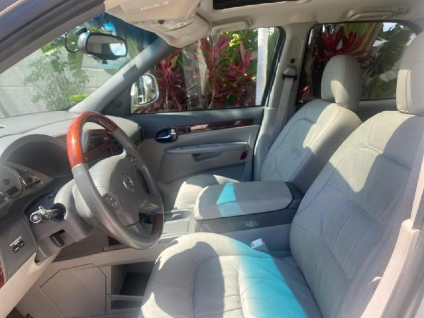2005 Platinum Metallic /Gray Buick Rendezvous LOW MILES 81,783 3RD ROW (3G5DA03E15S) with an 3.4L 3400 V6 SFI Engine engine, Automatic transmission, located at 4701 North Dixie Hwy, Pompano Beach, FL, 33064, (954) 422-2889, 26.240938, -80.123474 - OUR WEBPAGE FLORIDACARS1.COM HAS OVER 100 PHOTOS AND FREE CARFAX LINK 2005 BUICK RENDEZVOUS CX VIN: 3G5DA03E15S512878 3 G 5 D A 0 3 E 1 5 S 5 1 2 8 7 8 4 DOOR WAGON/SPORT UTILITY 3.4L V6 F GASOLINE FRONT WHEEL DRIVE Top Features Front Seat Heaters Leather Seats Parking Sensors Sunroof(s) Third Row S - Photo#34
