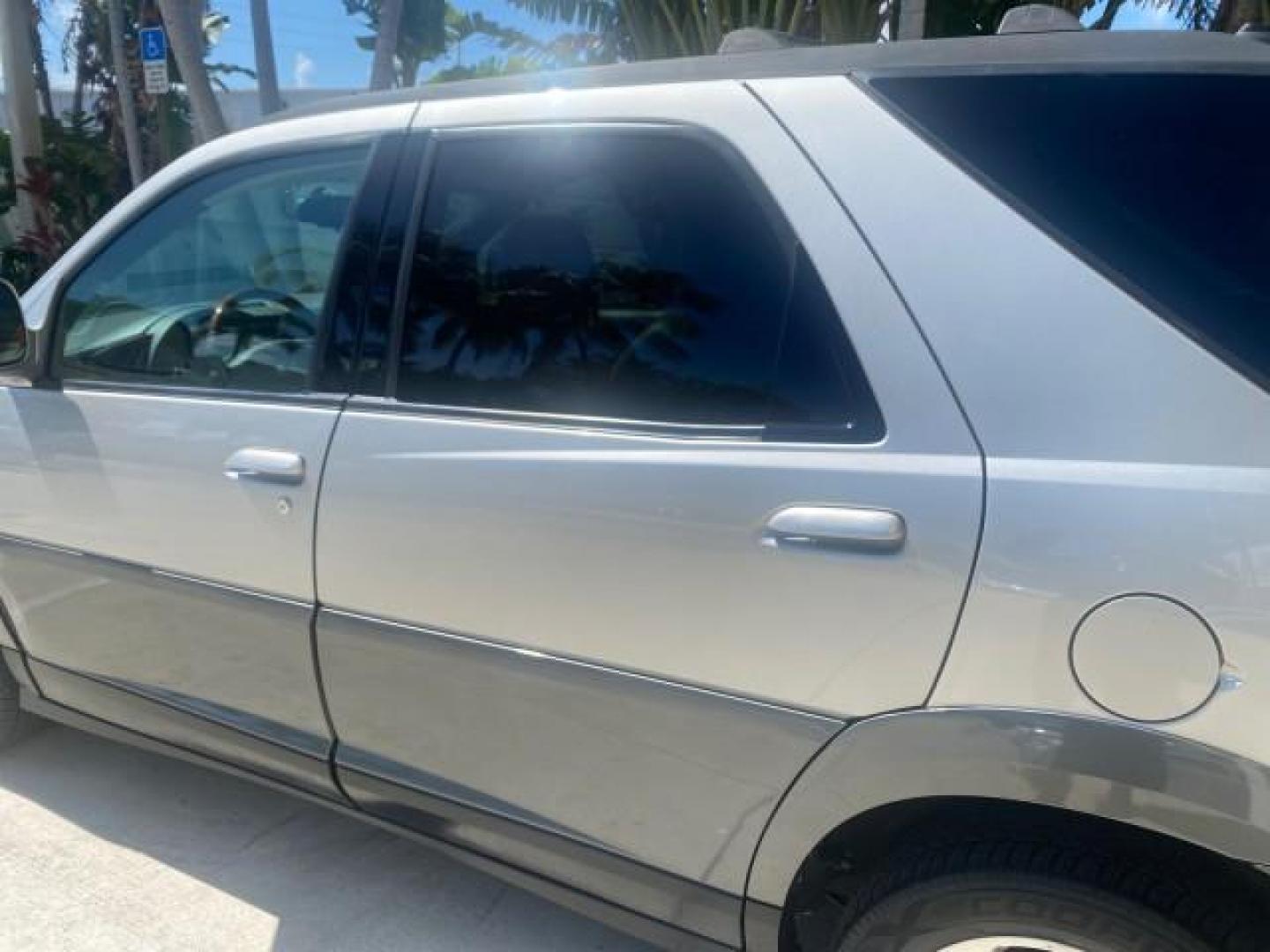 2005 Platinum Metallic /Gray Buick Rendezvous LOW MILES 81,783 3RD ROW (3G5DA03E15S) with an 3.4L 3400 V6 SFI Engine engine, Automatic transmission, located at 4701 North Dixie Hwy, Pompano Beach, FL, 33064, (954) 422-2889, 26.240938, -80.123474 - OUR WEBPAGE FLORIDACARS1.COM HAS OVER 100 PHOTOS AND FREE CARFAX LINK 2005 BUICK RENDEZVOUS CX VIN: 3G5DA03E15S512878 3 G 5 D A 0 3 E 1 5 S 5 1 2 8 7 8 4 DOOR WAGON/SPORT UTILITY 3.4L V6 F GASOLINE FRONT WHEEL DRIVE Top Features Front Seat Heaters Leather Seats Parking Sensors Sunroof(s) Third Row S - Photo#64