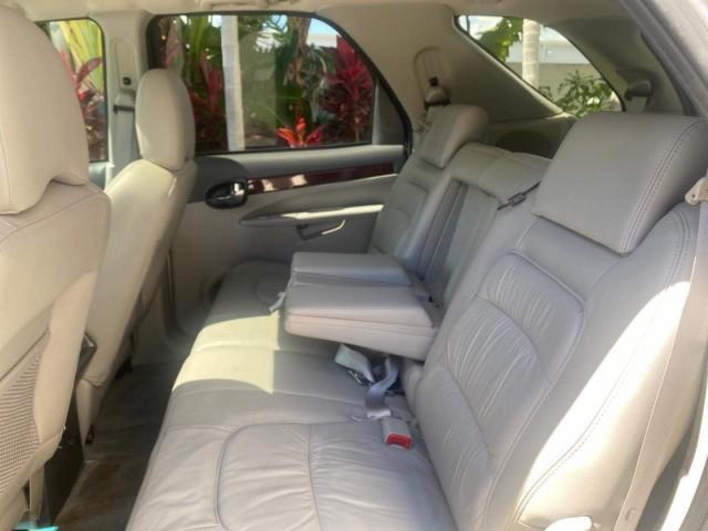2005 Platinum Metallic /Gray Buick Rendezvous LOW MILES 81,783 3RD ROW (3G5DA03E15S) with an 3.4L 3400 V6 SFI Engine engine, Automatic transmission, located at 4701 North Dixie Hwy, Pompano Beach, FL, 33064, (954) 422-2889, 26.240938, -80.123474 - OUR WEBPAGE FLORIDACARS1.COM HAS OVER 100 PHOTOS AND FREE CARFAX LINK 2005 BUICK RENDEZVOUS CX VIN: 3G5DA03E15S512878 3 G 5 D A 0 3 E 1 5 S 5 1 2 8 7 8 4 DOOR WAGON/SPORT UTILITY 3.4L V6 F GASOLINE FRONT WHEEL DRIVE Top Features Front Seat Heaters Leather Seats Parking Sensors Sunroof(s) Third Row S - Photo#68