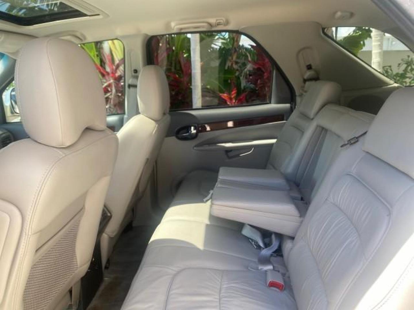 2005 Platinum Metallic /Gray Buick Rendezvous LOW MILES 81,783 3RD ROW (3G5DA03E15S) with an 3.4L 3400 V6 SFI Engine engine, Automatic transmission, located at 4701 North Dixie Hwy, Pompano Beach, FL, 33064, (954) 422-2889, 26.240938, -80.123474 - OUR WEBPAGE FLORIDACARS1.COM HAS OVER 100 PHOTOS AND FREE CARFAX LINK 2005 BUICK RENDEZVOUS CX VIN: 3G5DA03E15S512878 3 G 5 D A 0 3 E 1 5 S 5 1 2 8 7 8 4 DOOR WAGON/SPORT UTILITY 3.4L V6 F GASOLINE FRONT WHEEL DRIVE Top Features Front Seat Heaters Leather Seats Parking Sensors Sunroof(s) Third Row S - Photo#69