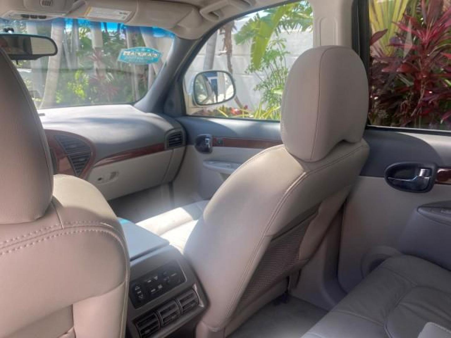 2005 Platinum Metallic /Gray Buick Rendezvous LOW MILES 81,783 3RD ROW (3G5DA03E15S) with an 3.4L 3400 V6 SFI Engine engine, Automatic transmission, located at 4701 North Dixie Hwy, Pompano Beach, FL, 33064, (954) 422-2889, 26.240938, -80.123474 - OUR WEBPAGE FLORIDACARS1.COM HAS OVER 100 PHOTOS AND FREE CARFAX LINK 2005 BUICK RENDEZVOUS CX VIN: 3G5DA03E15S512878 3 G 5 D A 0 3 E 1 5 S 5 1 2 8 7 8 4 DOOR WAGON/SPORT UTILITY 3.4L V6 F GASOLINE FRONT WHEEL DRIVE Top Features Front Seat Heaters Leather Seats Parking Sensors Sunroof(s) Third Row S - Photo#73