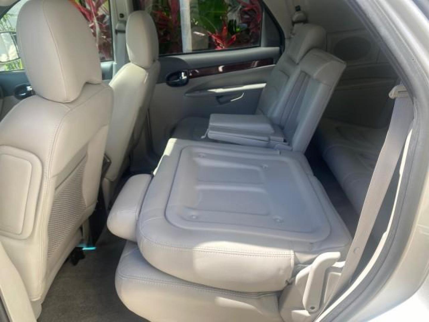 2005 Platinum Metallic /Gray Buick Rendezvous LOW MILES 81,783 3RD ROW (3G5DA03E15S) with an 3.4L 3400 V6 SFI Engine engine, Automatic transmission, located at 4701 North Dixie Hwy, Pompano Beach, FL, 33064, (954) 422-2889, 26.240938, -80.123474 - OUR WEBPAGE FLORIDACARS1.COM HAS OVER 100 PHOTOS AND FREE CARFAX LINK 2005 BUICK RENDEZVOUS CX VIN: 3G5DA03E15S512878 3 G 5 D A 0 3 E 1 5 S 5 1 2 8 7 8 4 DOOR WAGON/SPORT UTILITY 3.4L V6 F GASOLINE FRONT WHEEL DRIVE Top Features Front Seat Heaters Leather Seats Parking Sensors Sunroof(s) Third Row S - Photo#74