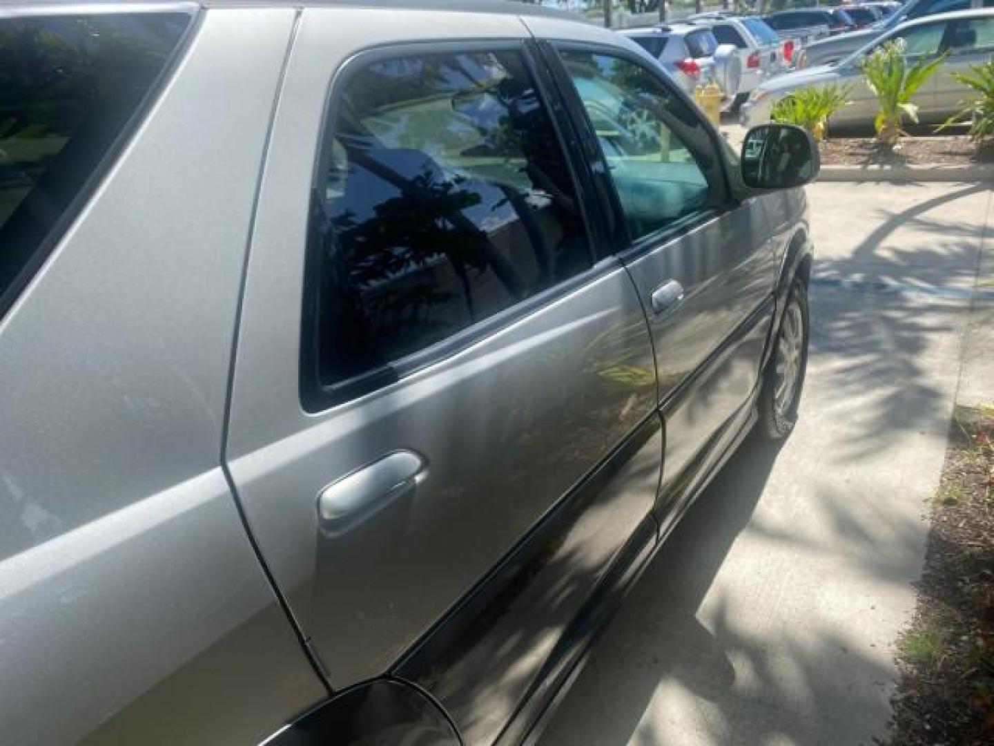 2005 Platinum Metallic /Gray Buick Rendezvous LOW MILES 81,783 3RD ROW (3G5DA03E15S) with an 3.4L 3400 V6 SFI Engine engine, Automatic transmission, located at 4701 North Dixie Hwy, Pompano Beach, FL, 33064, (954) 422-2889, 26.240938, -80.123474 - OUR WEBPAGE FLORIDACARS1.COM HAS OVER 100 PHOTOS AND FREE CARFAX LINK 2005 BUICK RENDEZVOUS CX VIN: 3G5DA03E15S512878 3 G 5 D A 0 3 E 1 5 S 5 1 2 8 7 8 4 DOOR WAGON/SPORT UTILITY 3.4L V6 F GASOLINE FRONT WHEEL DRIVE Top Features Front Seat Heaters Leather Seats Parking Sensors Sunroof(s) Third Row S - Photo#95