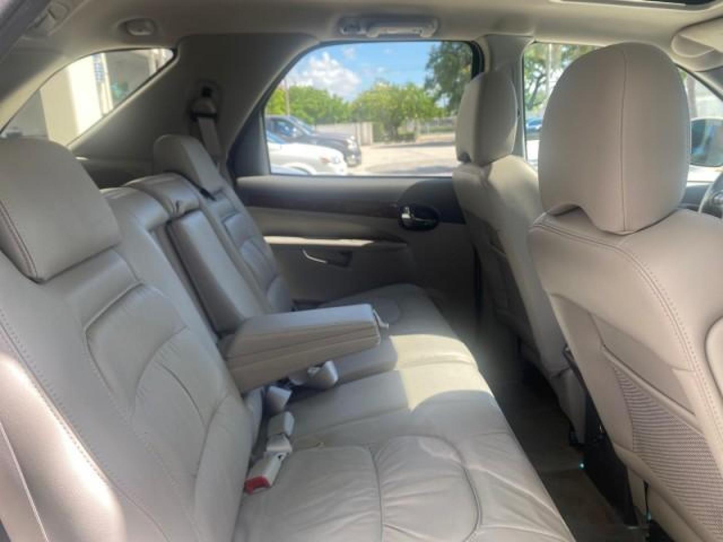 2005 Platinum Metallic /Gray Buick Rendezvous LOW MILES 81,783 3RD ROW (3G5DA03E15S) with an 3.4L 3400 V6 SFI Engine engine, Automatic transmission, located at 4701 North Dixie Hwy, Pompano Beach, FL, 33064, (954) 422-2889, 26.240938, -80.123474 - OUR WEBPAGE FLORIDACARS1.COM HAS OVER 100 PHOTOS AND FREE CARFAX LINK 2005 BUICK RENDEZVOUS CX VIN: 3G5DA03E15S512878 3 G 5 D A 0 3 E 1 5 S 5 1 2 8 7 8 4 DOOR WAGON/SPORT UTILITY 3.4L V6 F GASOLINE FRONT WHEEL DRIVE Top Features Front Seat Heaters Leather Seats Parking Sensors Sunroof(s) Third Row S - Photo#99