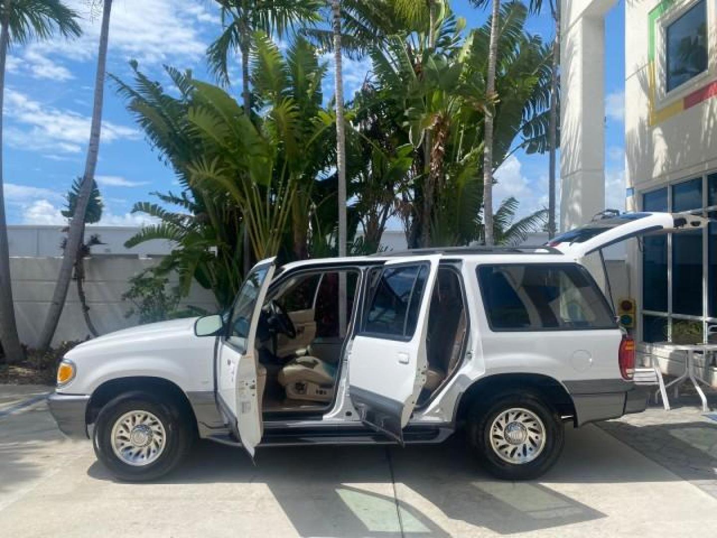 1999 Oxford White /Prairie Tan Mercury Mountaineer 1 OWNER FL LOW MILES (4M2DU52P6XU) with an 5.0L SEFI V8 Engine engine, Automatic transmission, located at 4701 North Dixie Hwy, Pompano Beach, FL, 33064, (954) 422-2889, 26.240938, -80.123474 - OUR WEBPAGE FLORIDACARS1.COM HAS OVER 100 PHOTOS AND FREE CARFAX LINK 1999 MERCURY MOUNTAINEER VIN: 4M2DU52P6XUJ01084 4 M 2 D U 5 2 P 6 X U J 0 1 0 8 4 4 DOOR WAGON/SPORT UTILITY WE ORDERED A NEW GLOVE BOX COVER 5.0L V8 F GASOLINE REAR WHEEL DRIVE Top Features Alloy Wheels Leather Seats Running Boar - Photo#8