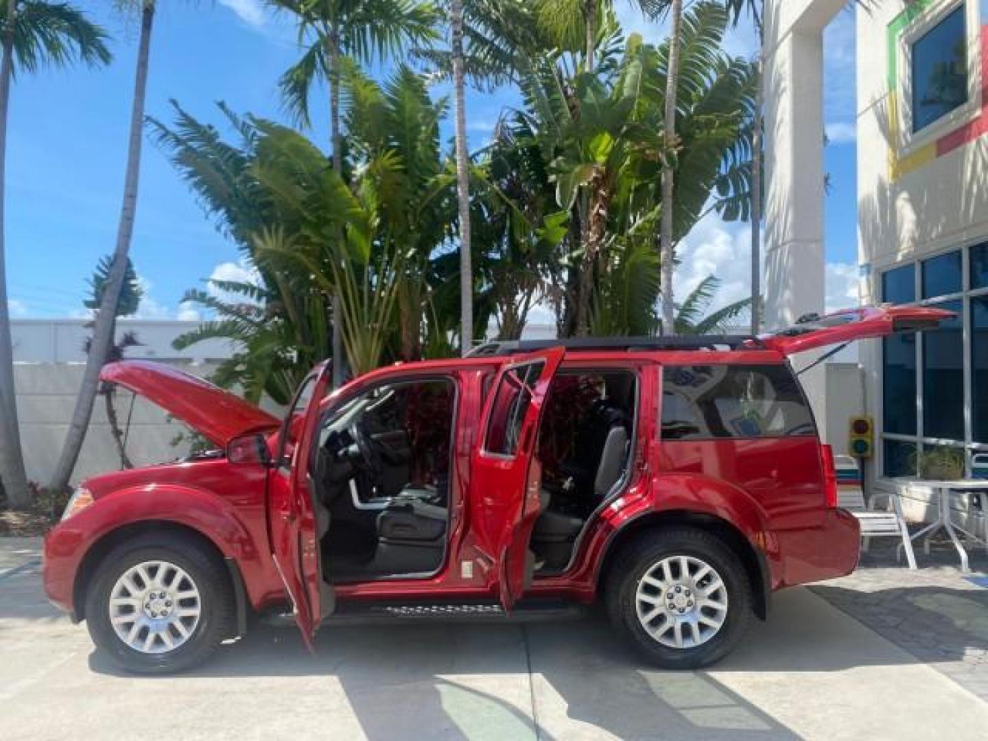 2011 Red Brick /Graphite Nissan Pathfinder LE 1 OWNER LOW MILES 54,257 (5N1AR1NN2BC) with an 4.0L DOHC 24-Valve V6 Engine engine, Automatic transmission, located at 4701 North Dixie Hwy, Pompano Beach, FL, 33064, (954) 422-2889, 26.240938, -80.123474 - OUR WEBPAGE FLORIDACARS1.COM HAS OVER 100 PHOTOS AND FREE CARFAX LINK 2011 NISSAN PATHFINDER S VIN: 5N1AR1NN2BC610435 5 N 1 A R 1 N N 2 B C 6 1 0 4 3 5 4 DOOR WAGON/SPORT UTILITY 4.0L V6 F DOHC 24V GASOLINE REAR WHEEL DRIVE Top Features Alloy Wheels BOSE Sound System Fold-Away Third Row Front Seat H - Photo#8