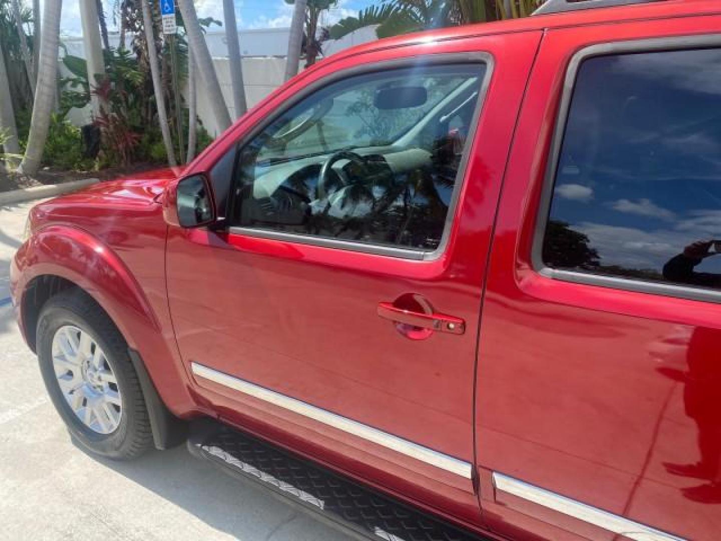 2011 Red Brick /Graphite Nissan Pathfinder LE 1 OWNER LOW MILES 54,257 (5N1AR1NN2BC) with an 4.0L DOHC 24-Valve V6 Engine engine, Automatic transmission, located at 4701 North Dixie Hwy, Pompano Beach, FL, 33064, (954) 422-2889, 26.240938, -80.123474 - OUR WEBPAGE FLORIDACARS1.COM HAS OVER 100 PHOTOS AND FREE CARFAX LINK 2011 NISSAN PATHFINDER S VIN: 5N1AR1NN2BC610435 5 N 1 A R 1 N N 2 B C 6 1 0 4 3 5 4 DOOR WAGON/SPORT UTILITY 4.0L V6 F DOHC 24V GASOLINE REAR WHEEL DRIVE Top Features Alloy Wheels BOSE Sound System Fold-Away Third Row Front Seat H - Photo#27