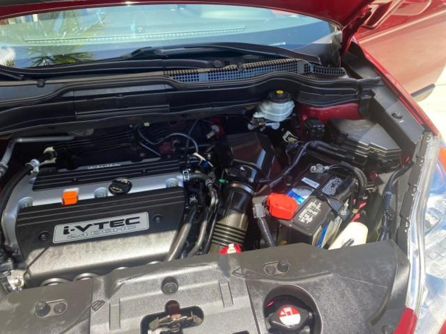 2008 Tango Red Pearl /Gray Honda CR-V EX-L LOW MILES 67,975 (JHLRE38708C) with an 2.4L DOHC MPFI 16-Valve i-VTEC I4 Engine engine, Automatic transmission, located at 4701 North Dixie Hwy, Pompano Beach, FL, 33064, (954) 422-2889, 26.240938, -80.123474 - OUR WEBPAGE FLORIDACARS1.COM HAS OVER 100 PHOTOS AND FREE CARFAX LINK 2008 HONDA CR-V EX-L VIN:JHLRE38708C027319 4 DOOR WAGON/SPORT UTILITY 2.4L I4 F DOHC 16V GASOLINE FRONT WHEEL DRIVE Top Features Alloy Wheels Front Seat Heaters Leather Seats Running Boards Satellite Radio Ready Sunroof(s) Basic F - Photo#26