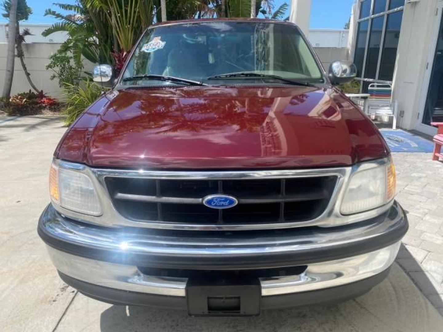 1997 Dark Toreador Red (CC/Met) /Medium Prarie Tan Ford F-150 XLT 1 OWNER LOW MILES 74,027 (1FTDX17W5VK) with an 4.6L EFI OHC V8 Triton Engine engine, Automatic transmission, located at 4701 North Dixie Hwy, Pompano Beach, FL, 33064, (954) 422-2889, 26.240938, -80.123474 - OUR WEBPAGE FLORIDACARS1.COM HAS OVER 100 PHOTOS AND FREE CARFAX LINK 1997 FORD F-150 XLT VIN: 1FTDX17W5VKB56866 1 F T D X 1 7 W 5 V K B 5 6 8 6 6 3 DOOR EXTENDED CAB PICKUP 4.6L V8 F GASOLINE REAR WHEEL DRIVE Top Features Cloth Seats Tow Hitch Basic Features ABS Brakes AM/FM Stereo Air Conditioning - Photo#2