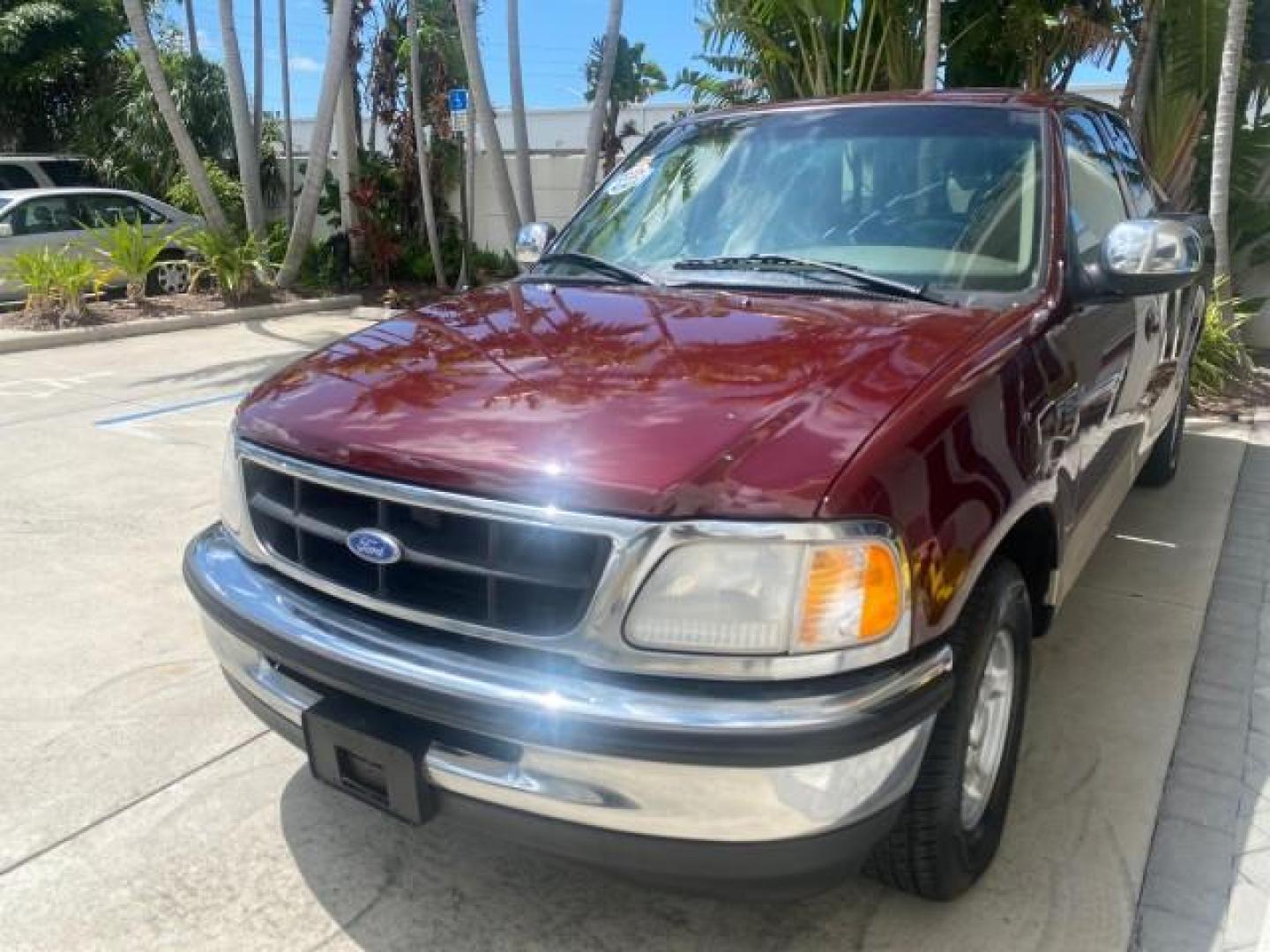1997 Dark Toreador Red (CC/Met) /Medium Prarie Tan Ford F-150 XLT 1 OWNER LOW MILES 74,027 (1FTDX17W5VK) with an 4.6L EFI OHC V8 Triton Engine engine, Automatic transmission, located at 4701 North Dixie Hwy, Pompano Beach, FL, 33064, (954) 422-2889, 26.240938, -80.123474 - OUR WEBPAGE FLORIDACARS1.COM HAS OVER 100 PHOTOS AND FREE CARFAX LINK 1997 FORD F-150 XLT VIN: 1FTDX17W5VKB56866 1 F T D X 1 7 W 5 V K B 5 6 8 6 6 3 DOOR EXTENDED CAB PICKUP 4.6L V8 F GASOLINE REAR WHEEL DRIVE Top Features Cloth Seats Tow Hitch Basic Features ABS Brakes AM/FM Stereo Air Conditioning - Photo#3